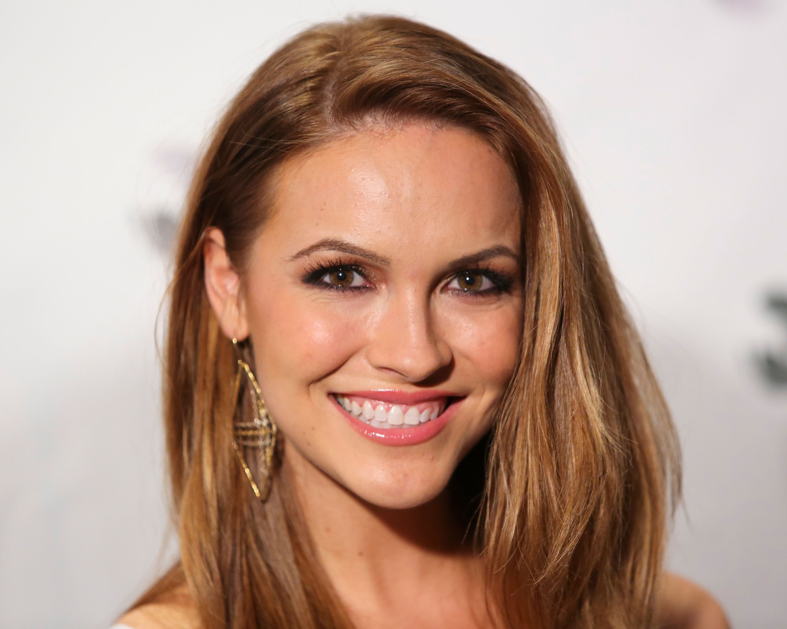 Chrishell Stause posing for a picture at a charity event