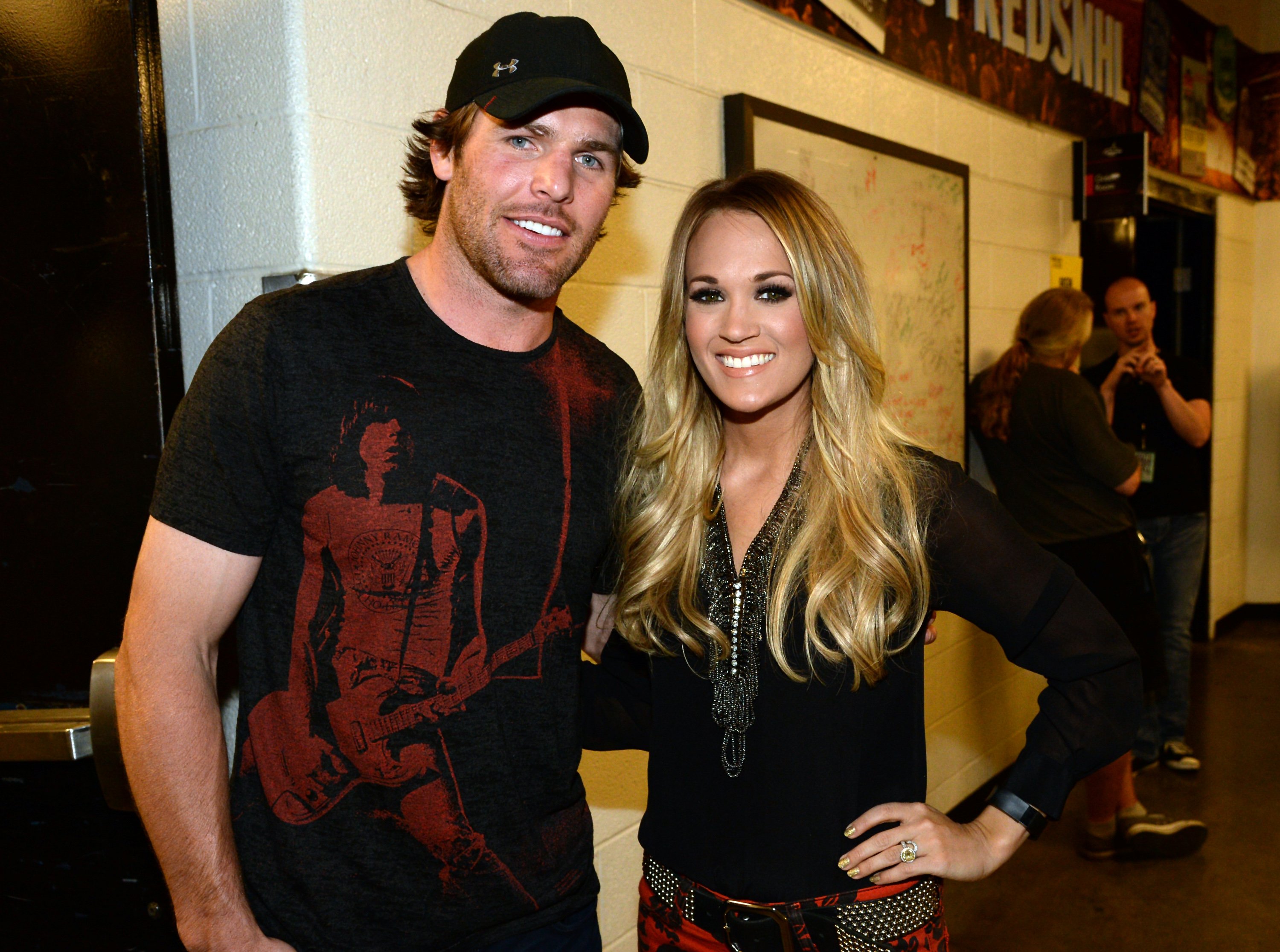 Carrie Underwood (right) and husband Mike Fisher