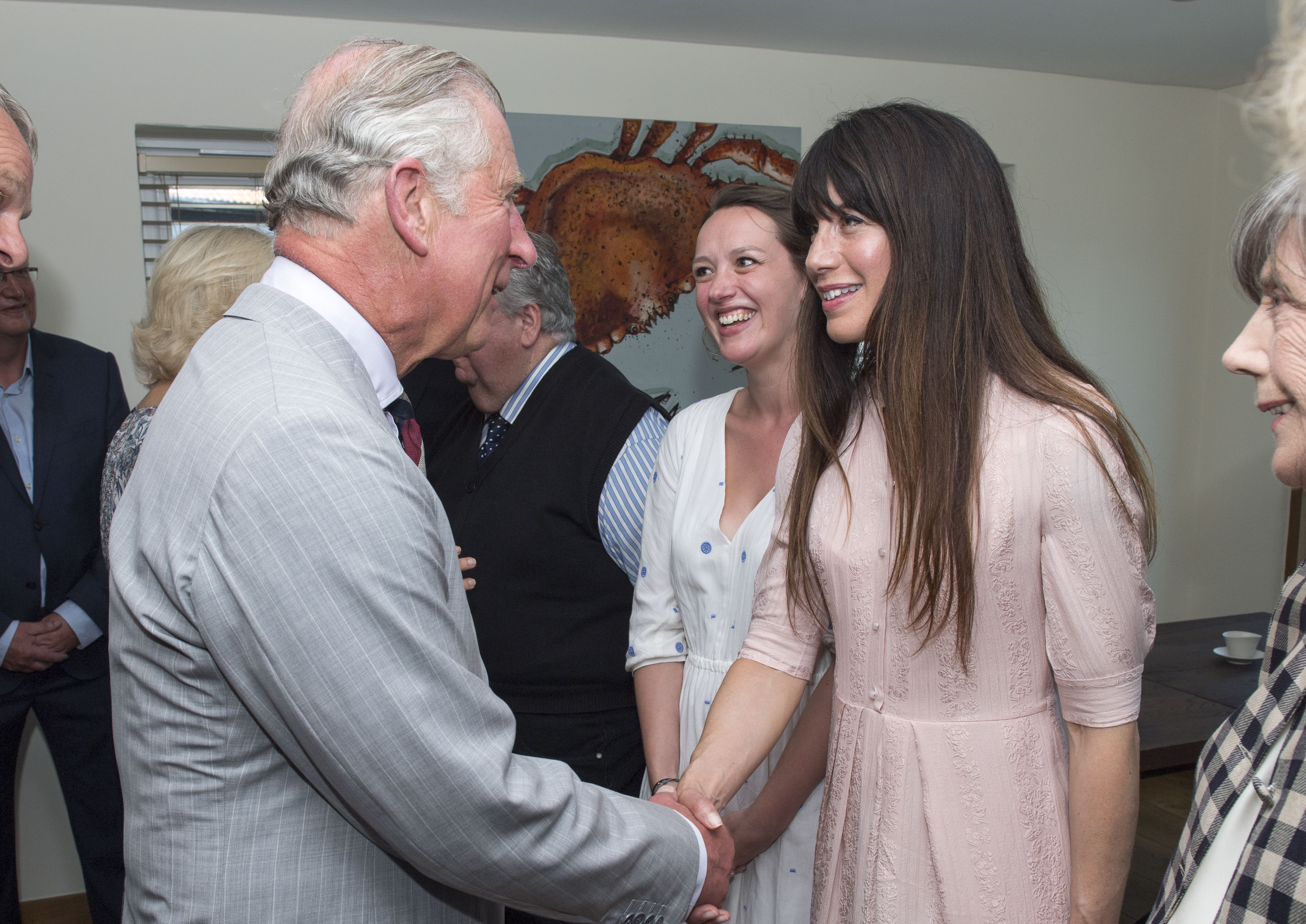 Caroline Catz (right) meeting Prince Charles in 2016