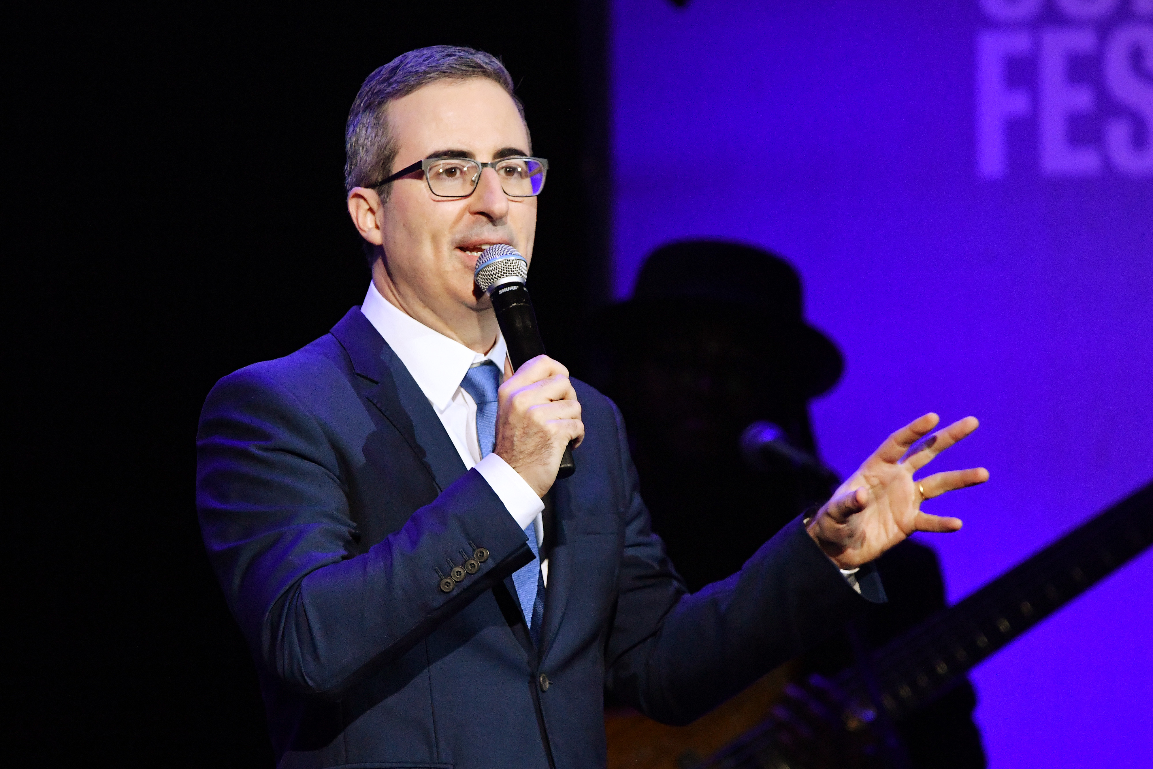 John Oliver performs onstage during the 13th annual Stand Up for Heroes to benefit the Bob Woodruff Foundation