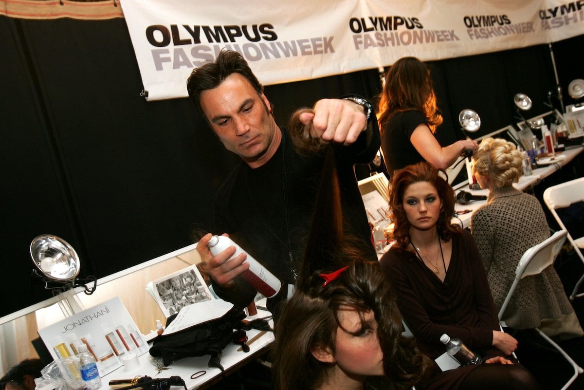 Stylist Jonathan Antin does a model's hair backstage at the Charles Nolan Fall 2006 fashion show 