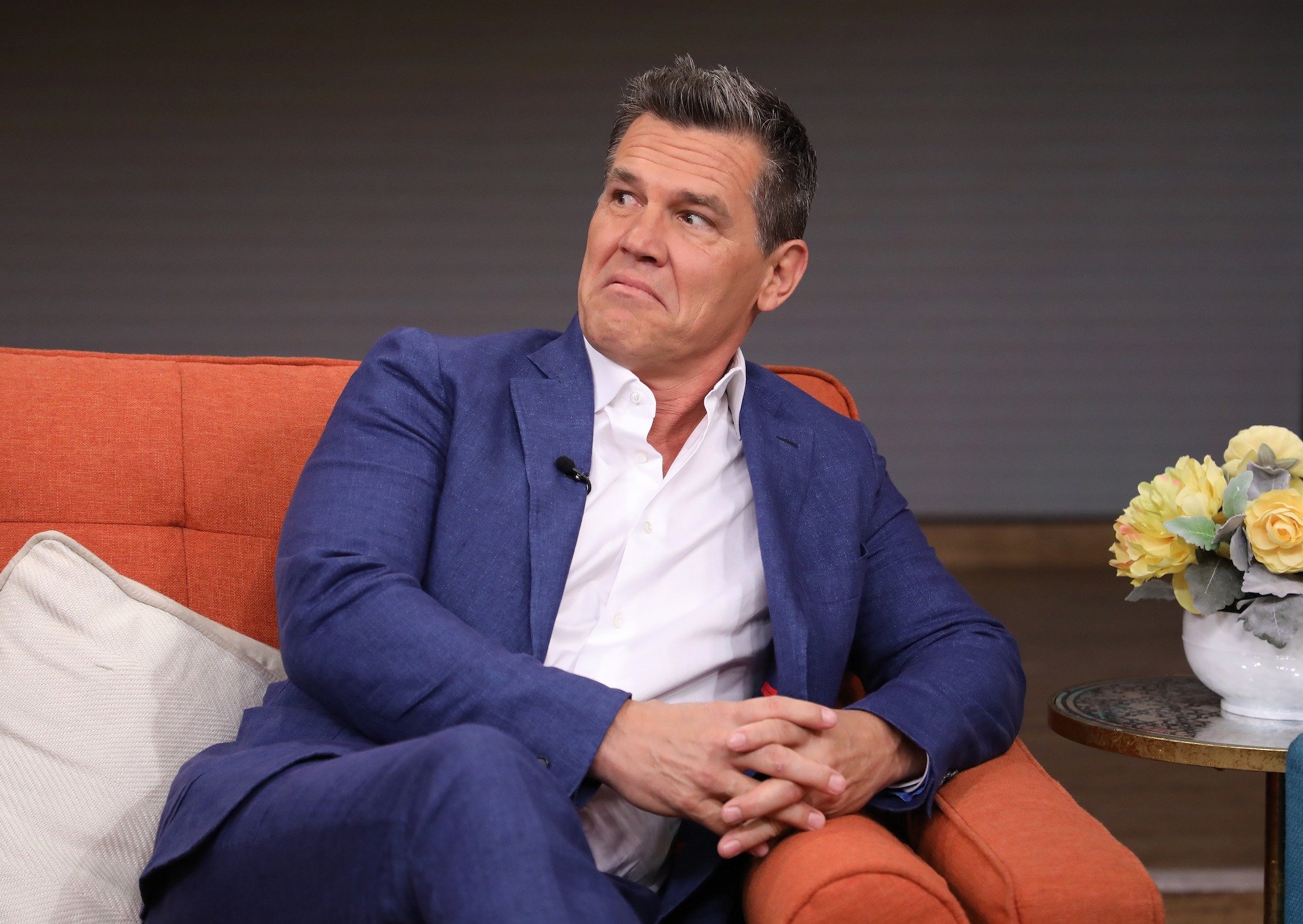 Josh Brolin frowning in surprise, looking to the left