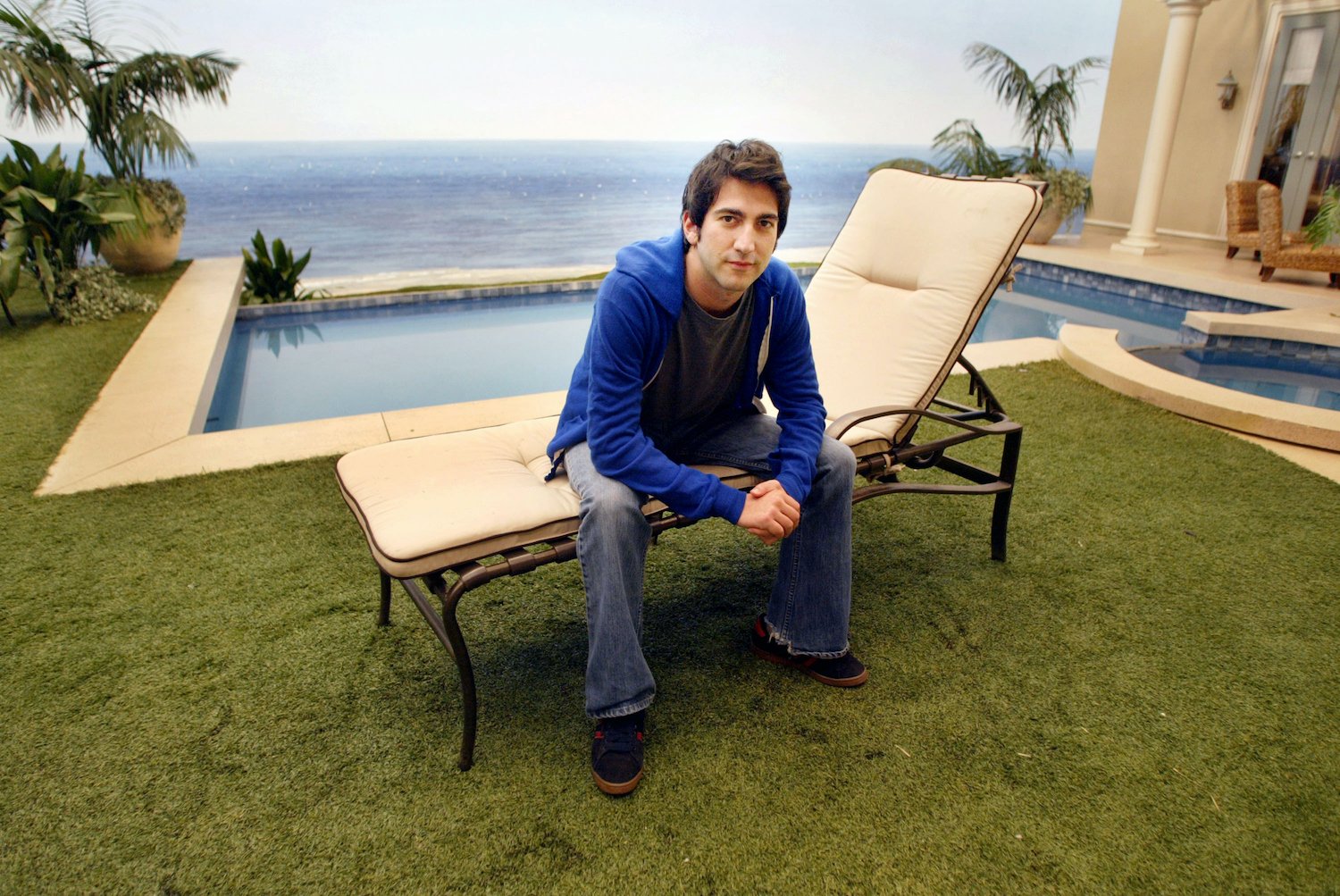 Josh Schwartz sits on a lounge chair on the set of 'The O.C.'