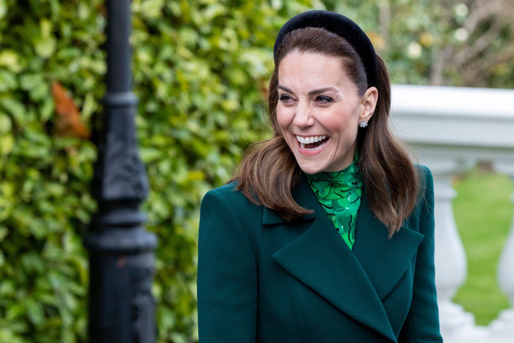 Kate Middleton, looking off camera, laughing