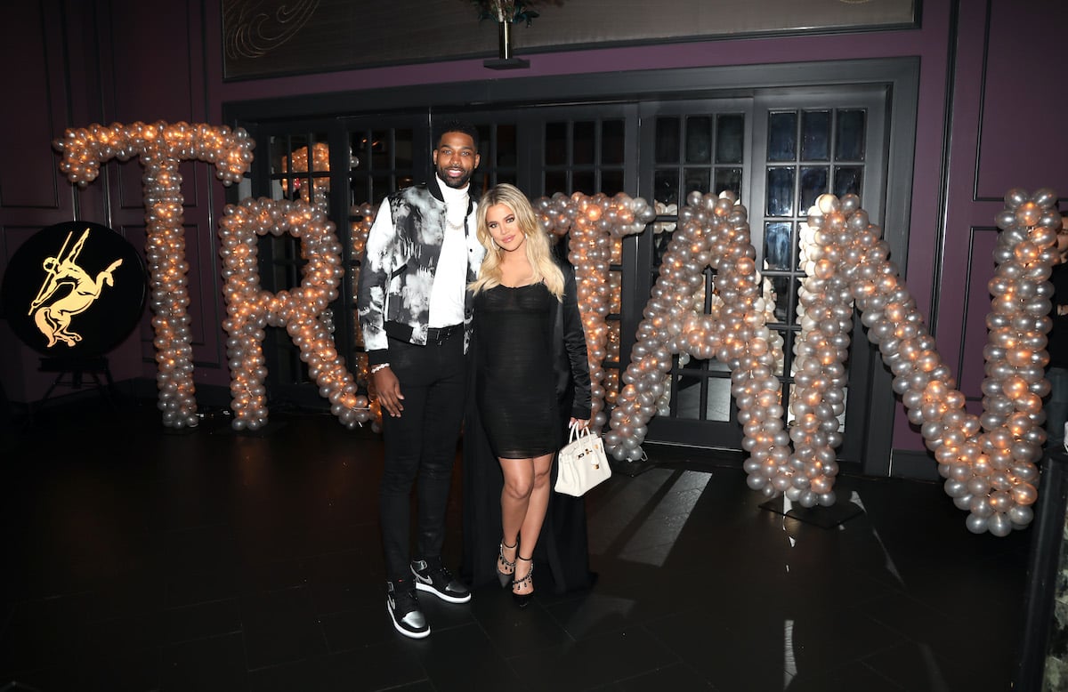 Tristan Thompson and Khloe Kardashian pose for a photo as Remy Martin celebrates Tristan Thompson's Birthday at Beauty & Essex on March 10, 2018 in Los Angeles, California