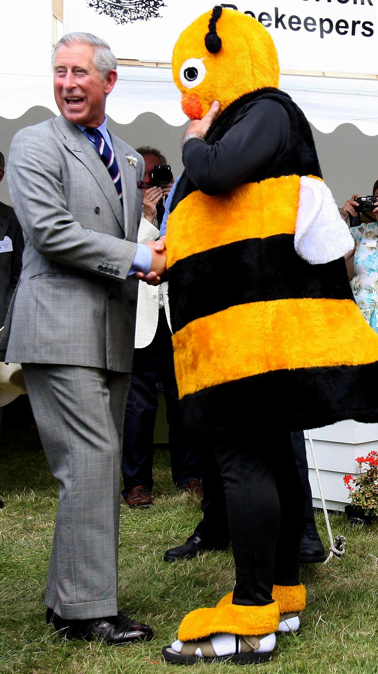 Prince Charles and beekeeper, Barry Walker-Moore, dressed as a bumble bee