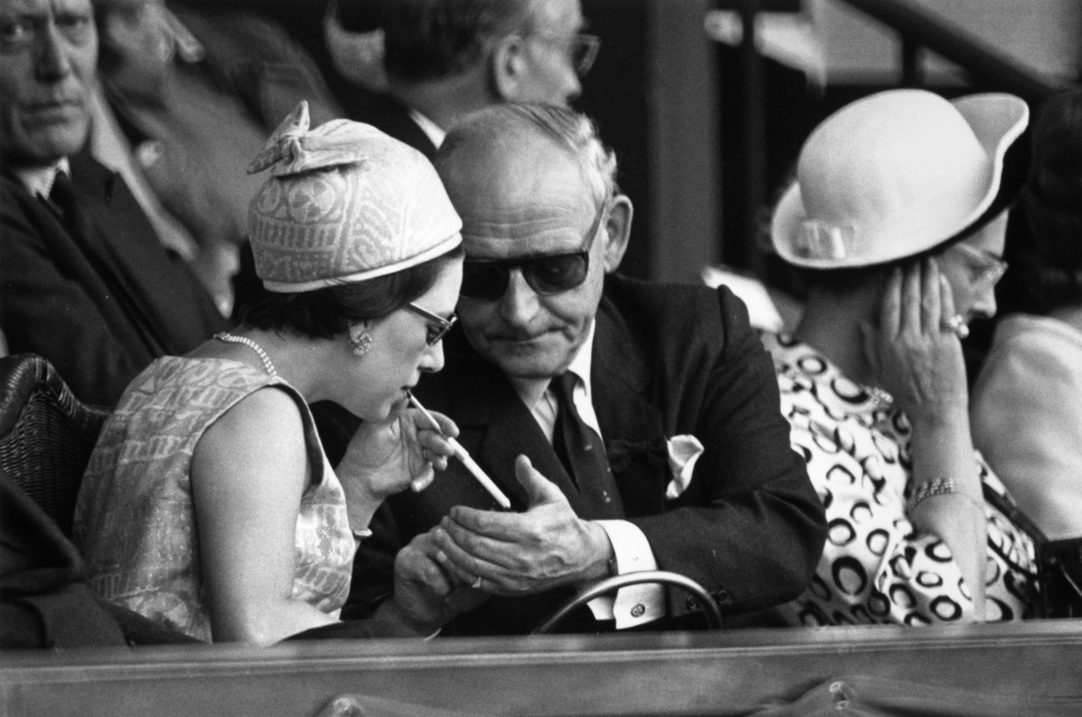 Princess Margaret getting a light for her cigarette