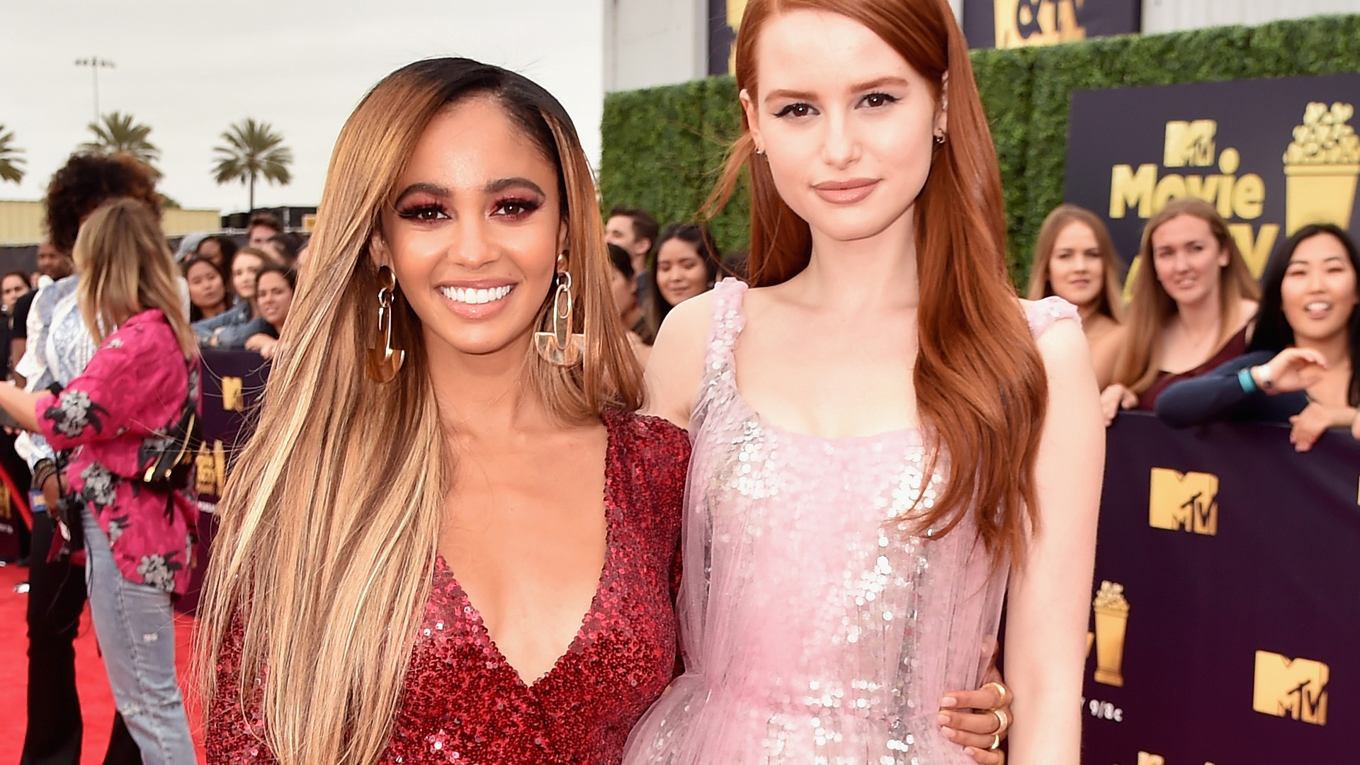 'Riverdale' stars Vanessa Morgan and Madelaine Petsch attend the 2018 MTV Movie And TV Awards at Barker Hangar on June 16, 2018 in Santa Monica, California.