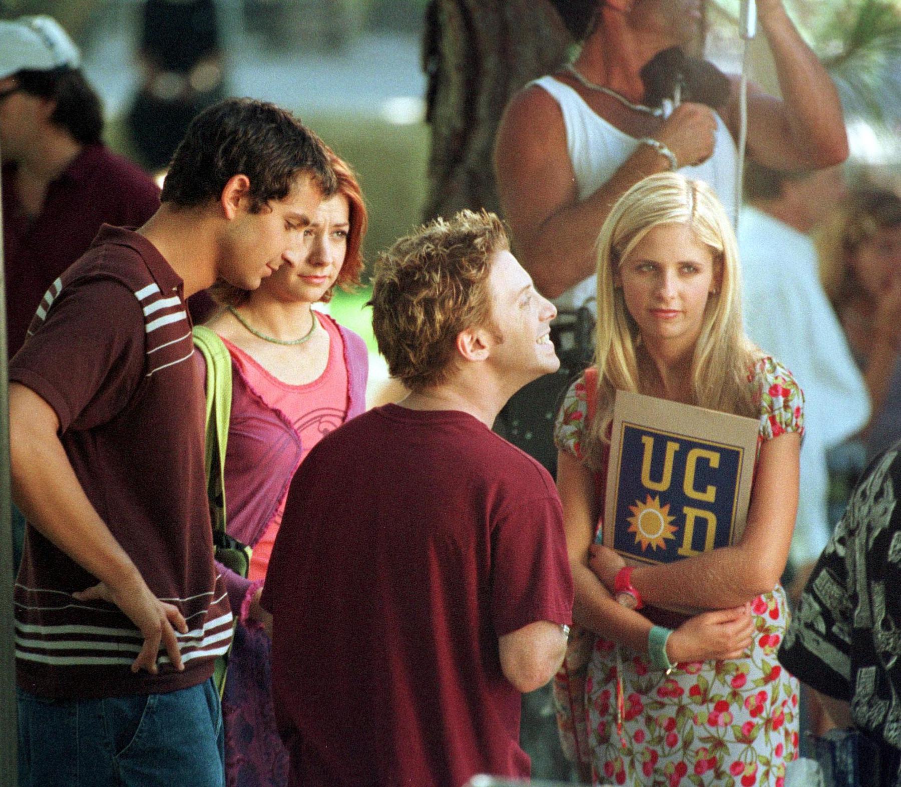 Sarah Michelle Gellar, Seth Green, and Alyson Hannigan filming a scene from 'Buffy the Vampire Slayer'