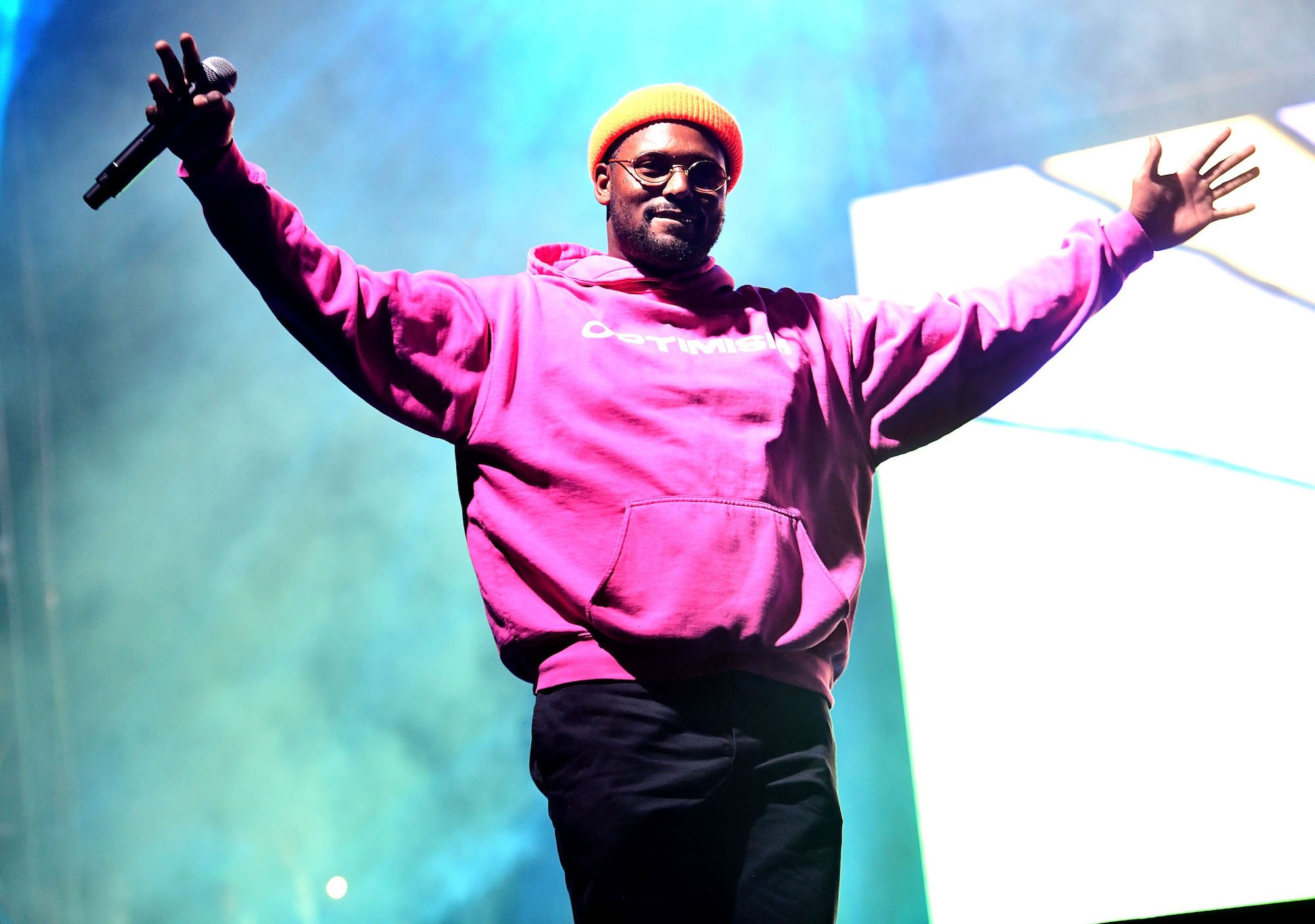 ScHoolboy Q with his arms outstretched on stage