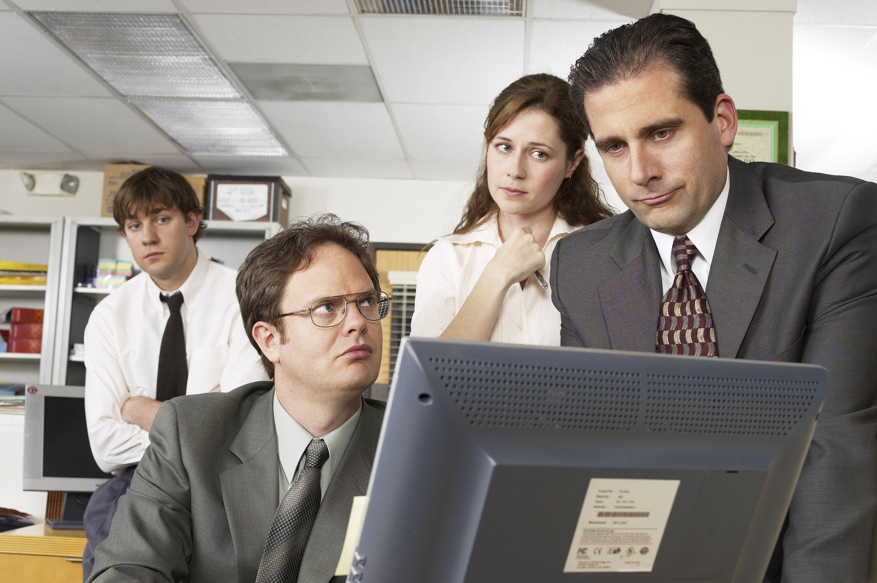 John Krasinski as Jim Halpert, Rainn Wilson as Dwight Schrute, Jenna Fischer as Pam Beesly, and Steve Carell as Michael Scott 