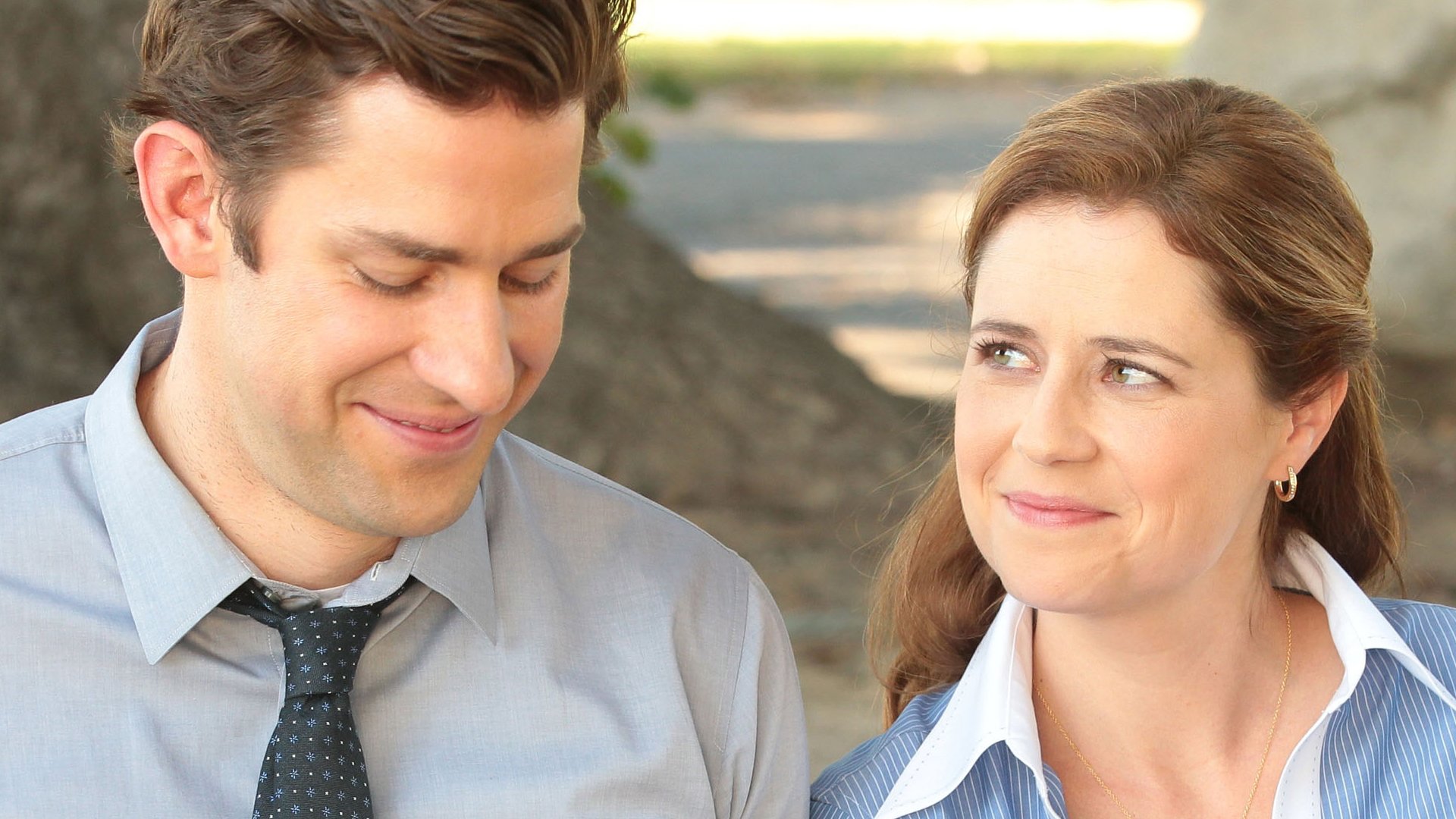 Jenna Fischer as Pam Beesly Halpert smiles at John Krasinski as Jim Halpert on 'The Office' Season 9 Episode 4 "Work Bus"