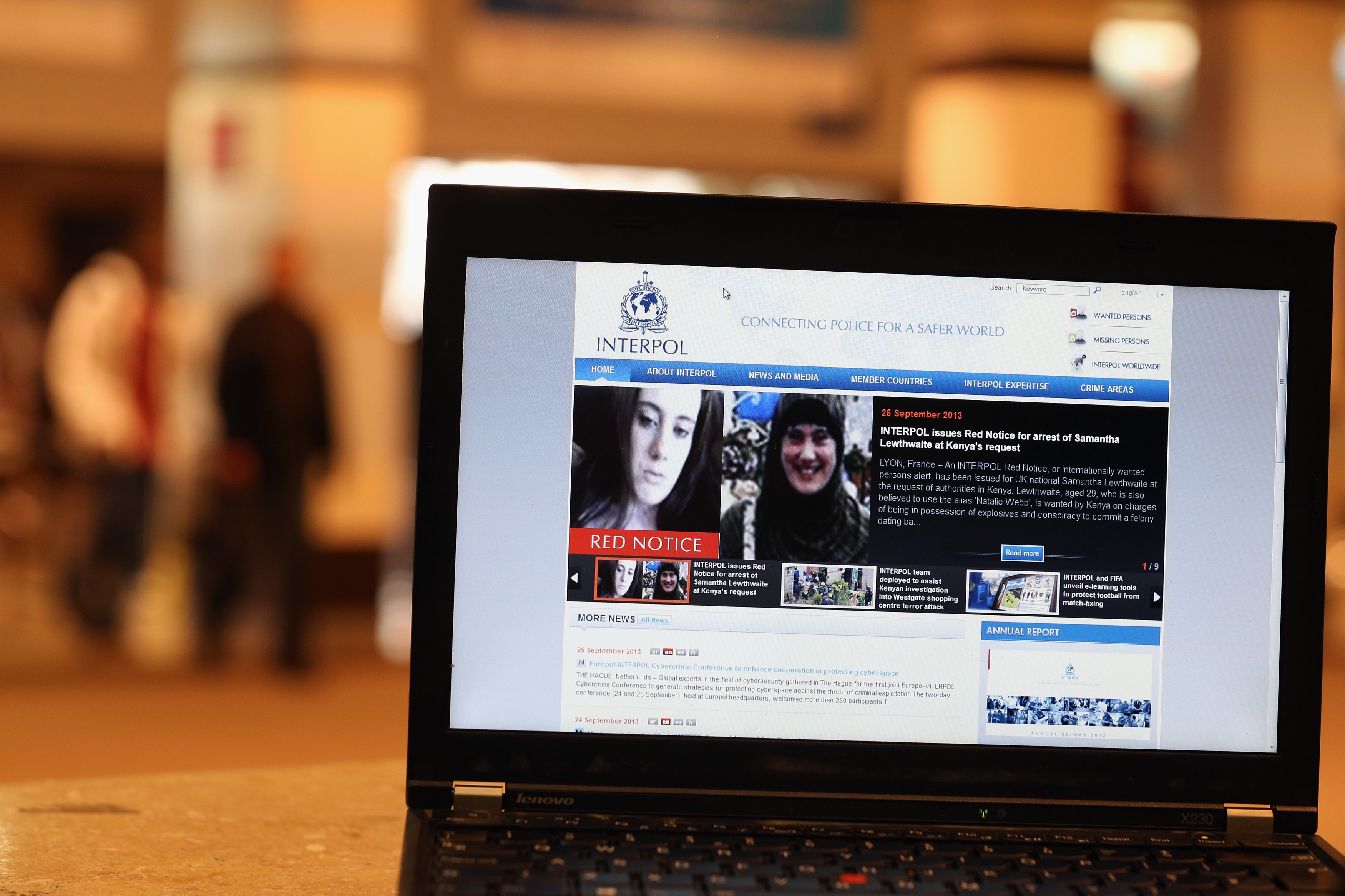 A view of a laptop computer screen showing the Interpol website which features a 'Red Notice' for the arrest of Samantha Lewthwaite