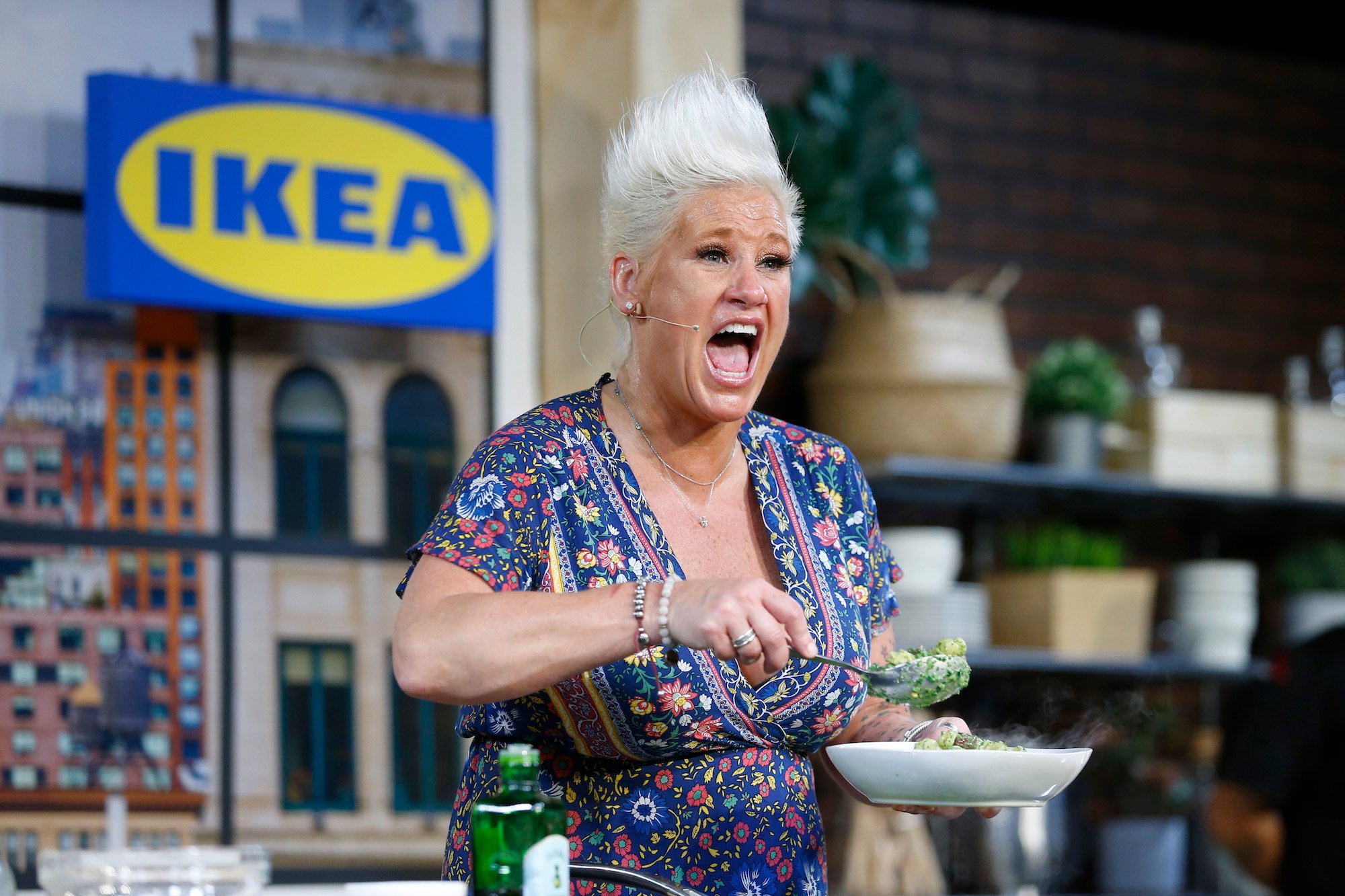 Anne Burrell prepares food in front of the camera