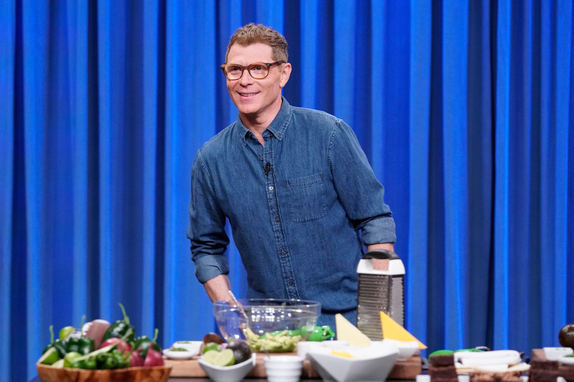 Chef Bobby Flay cooks in front of an audience
