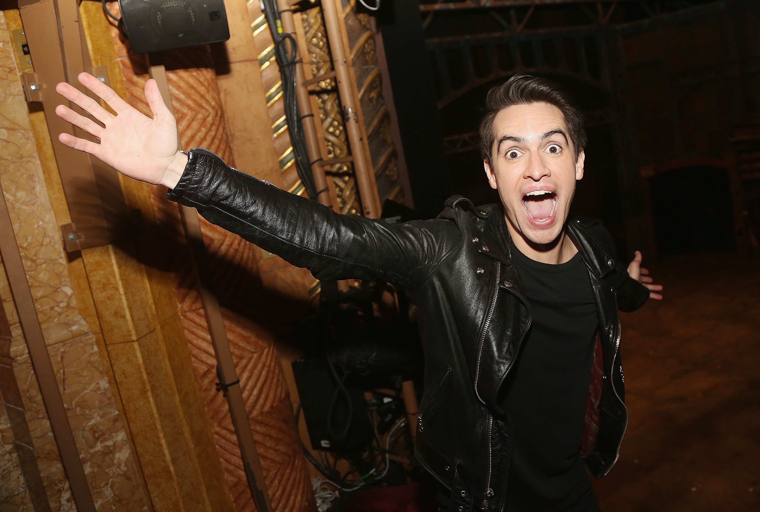 Brendon Urie of Panic! at the Disco raising his arm