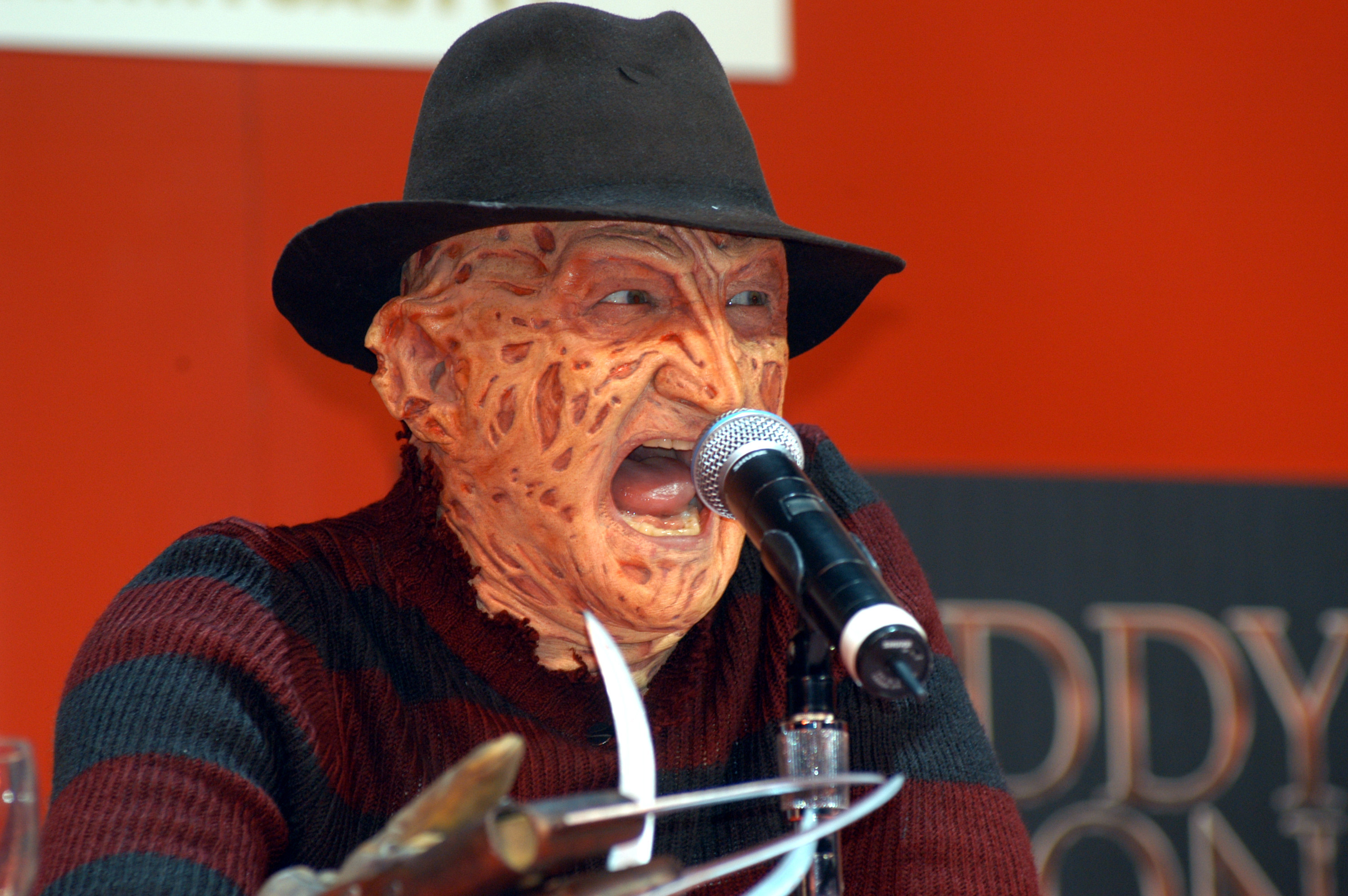 Freddy Krueger by a microphone