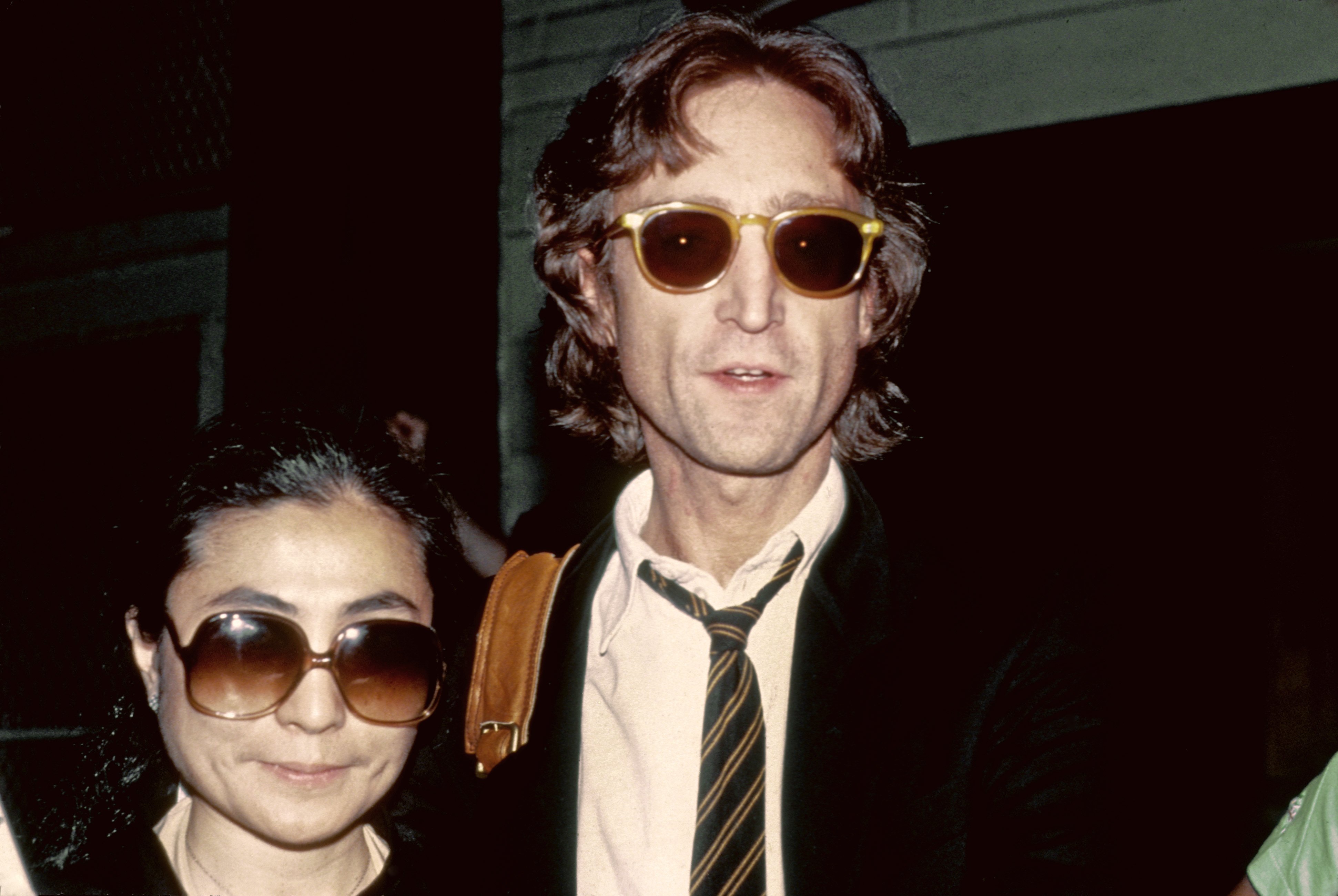 Yoko Ono and John Lennon wearing glasses