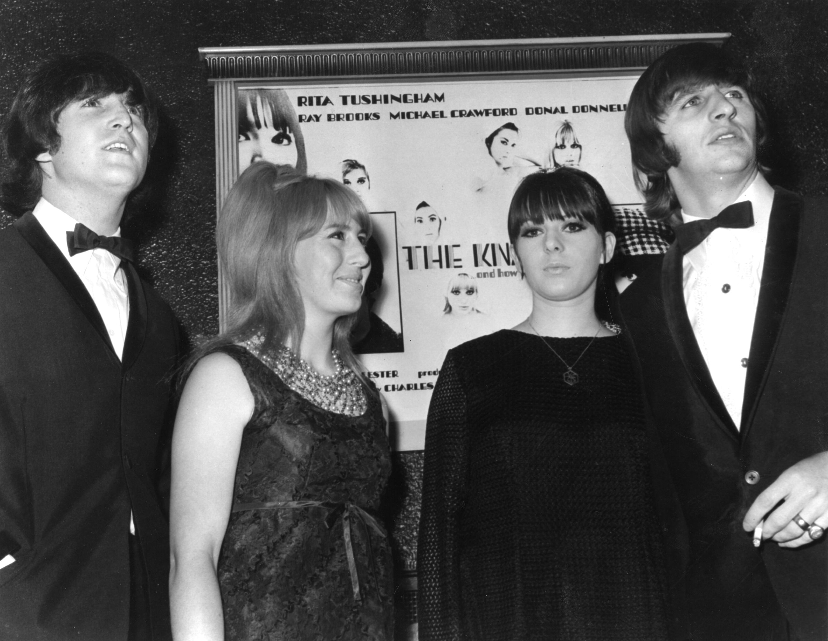 John Lennon, Cynthia Lennon, Maureen Starkey Tigrett, and Ringo Starr in front of a poster