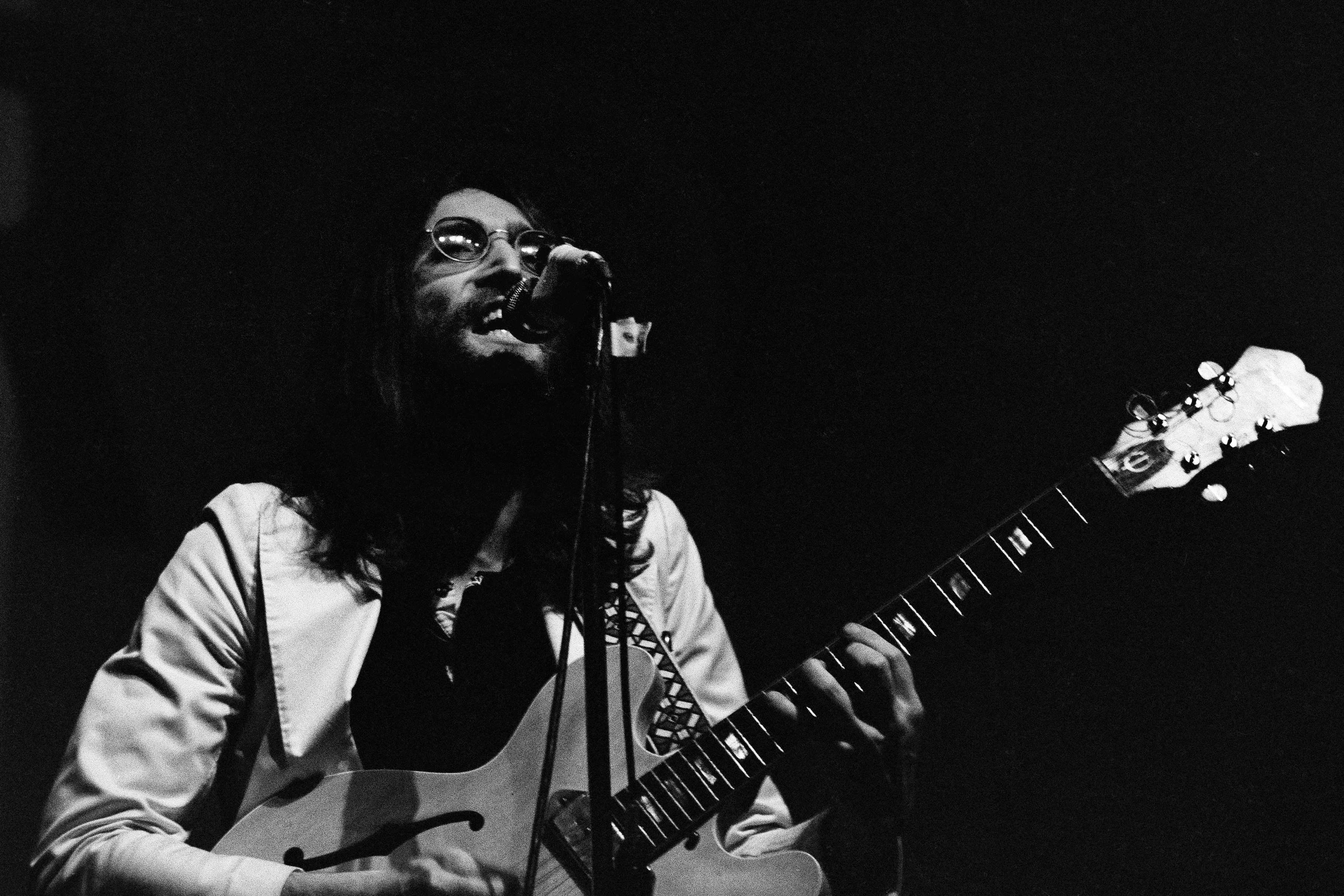 John Lennon with his guitar