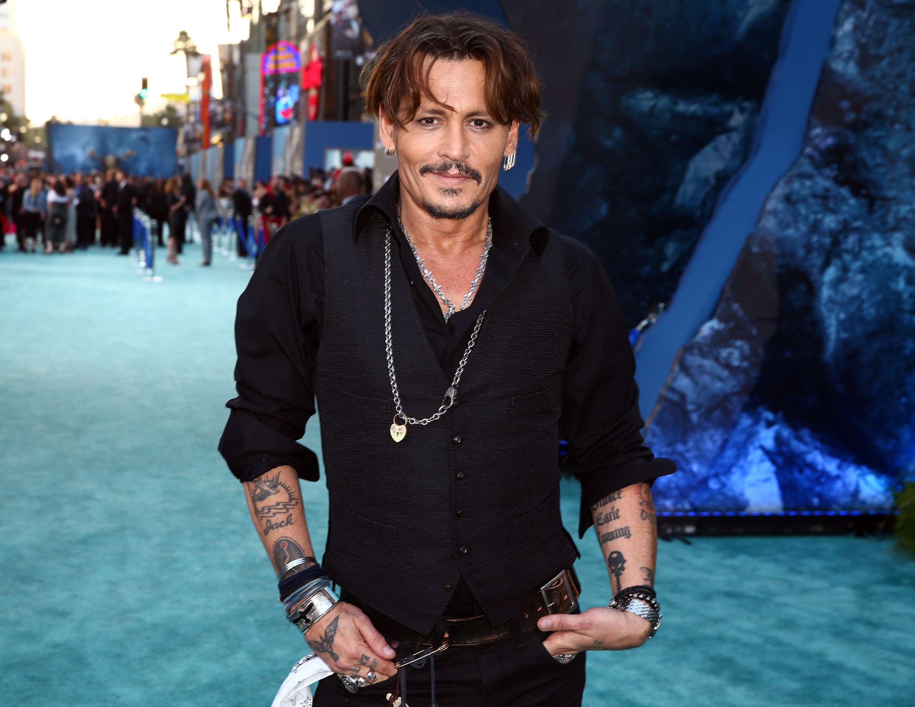 Johnny Depp wearing a necklace