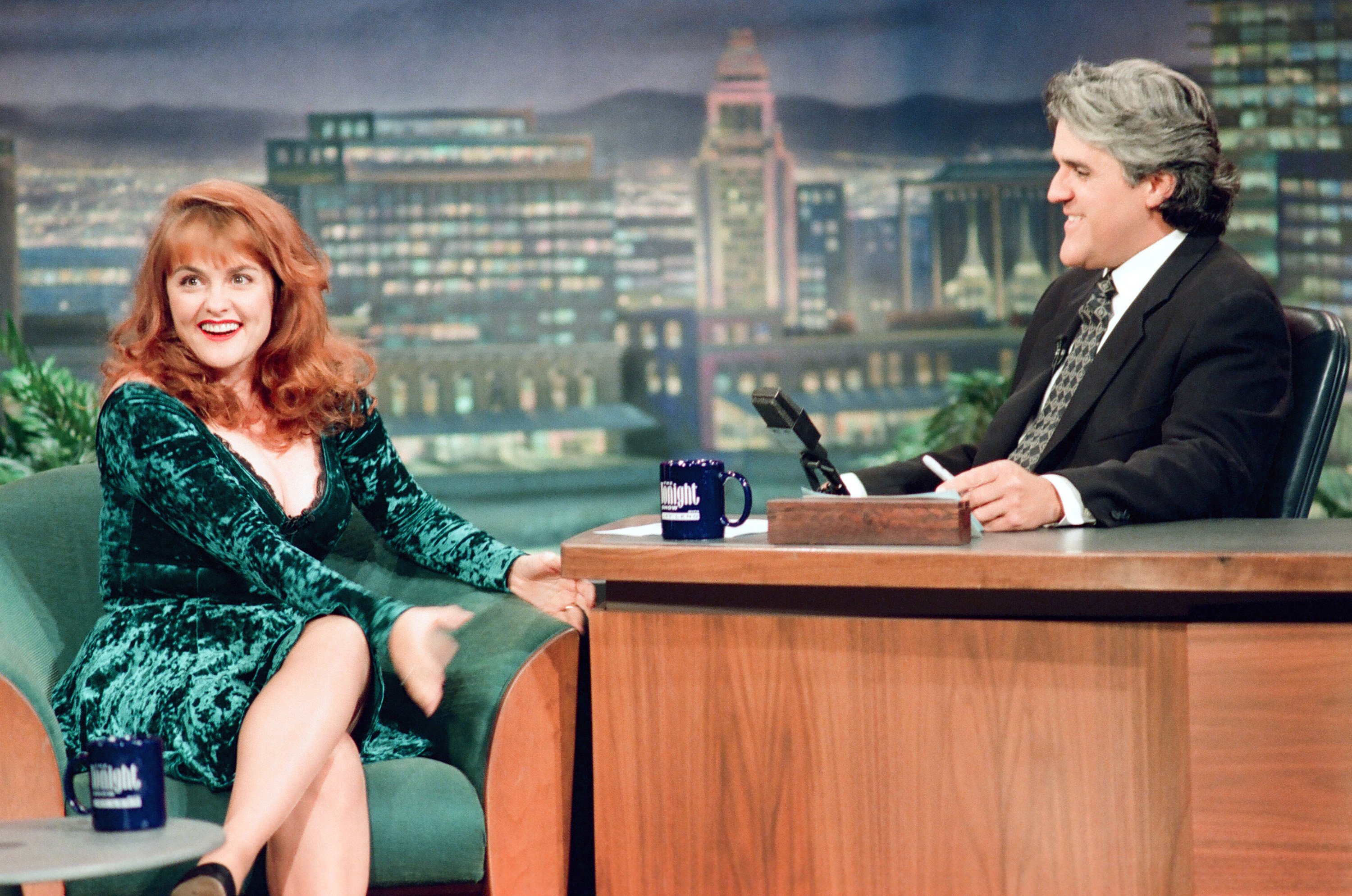 Julie Brown sitting next to Jay Leno's desk