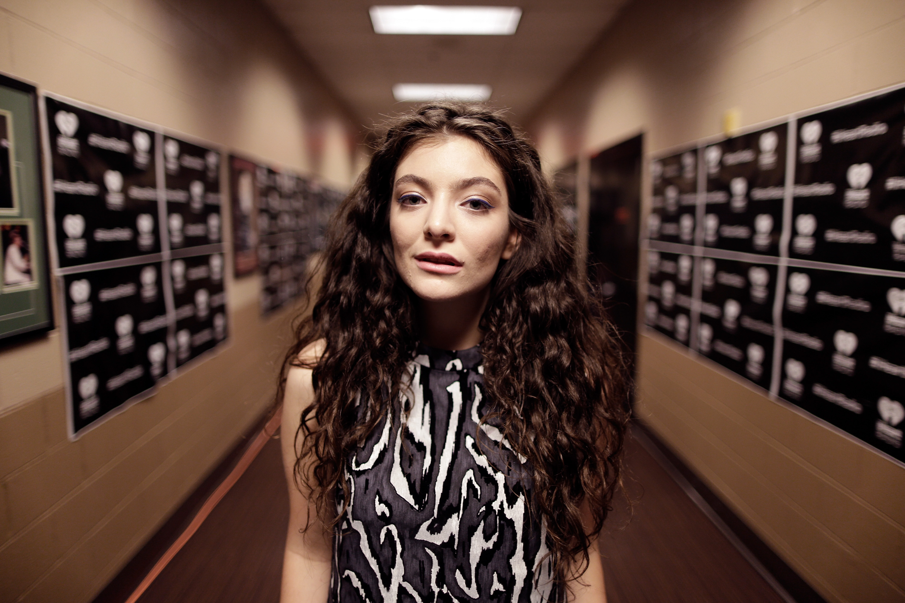 Lorde alone in a hallway