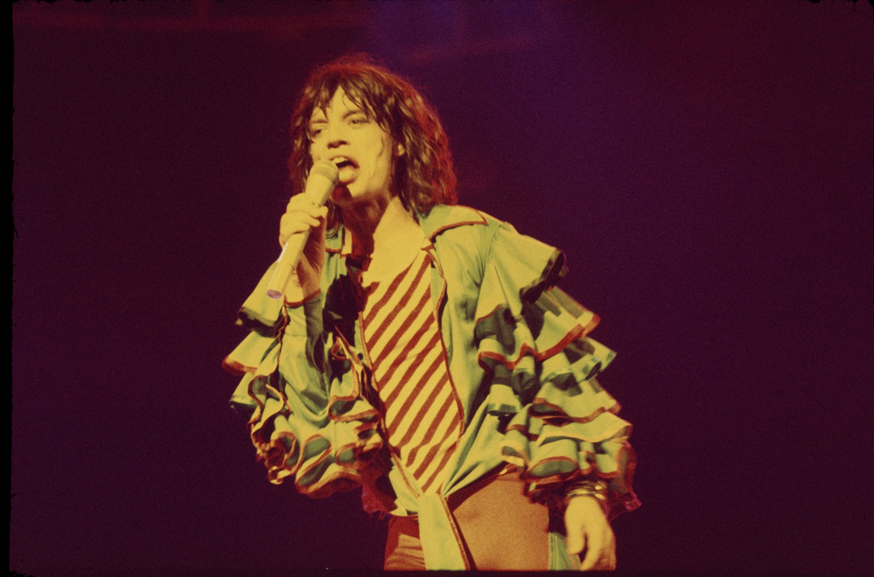 Mick Jagger holding a microphone