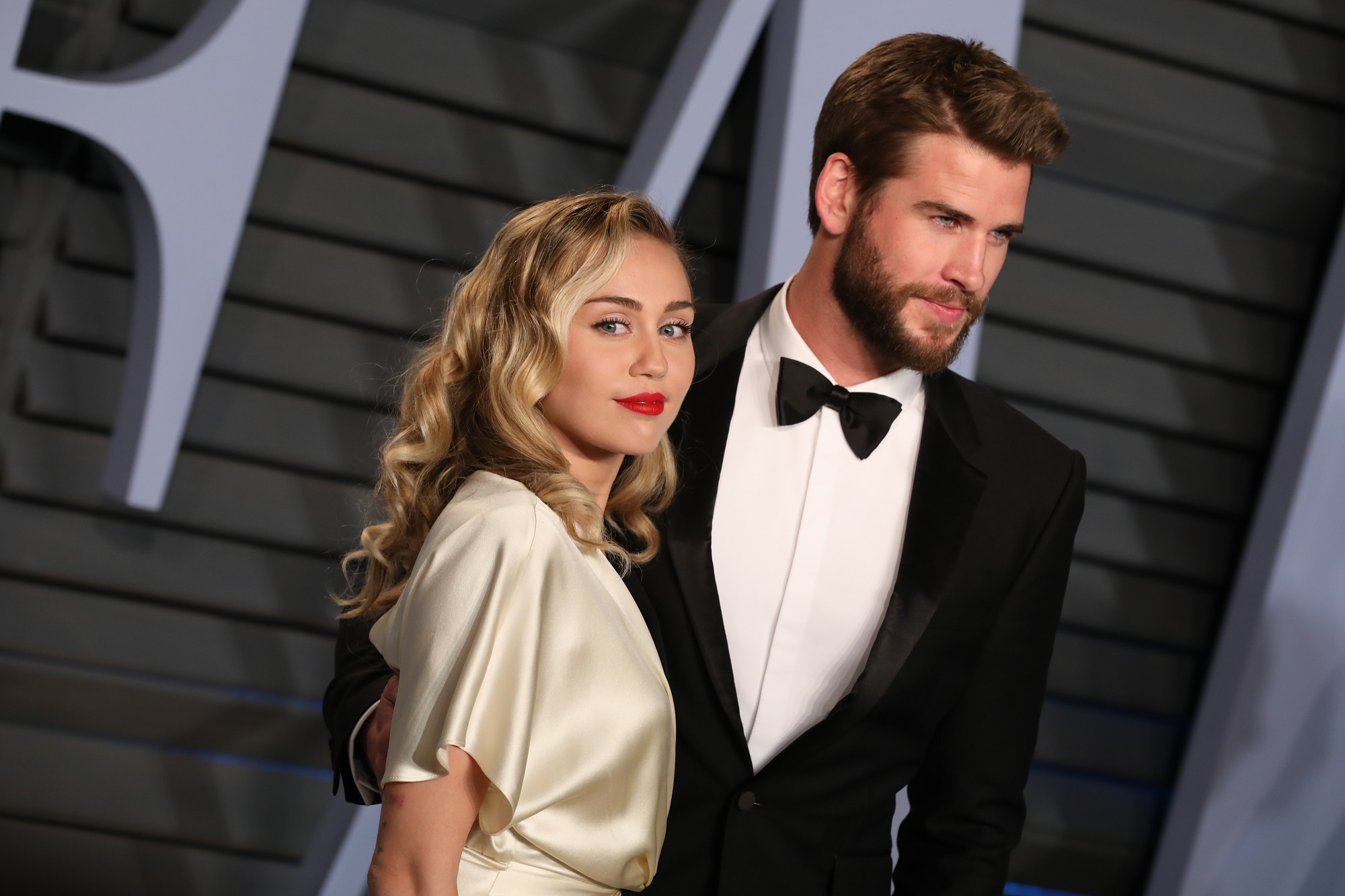 Miley Cyrus and Liam Hemsworth attend the 2018 Vanity Fair Oscar Party on March 04, 2018 in Beverly Hills, California. 