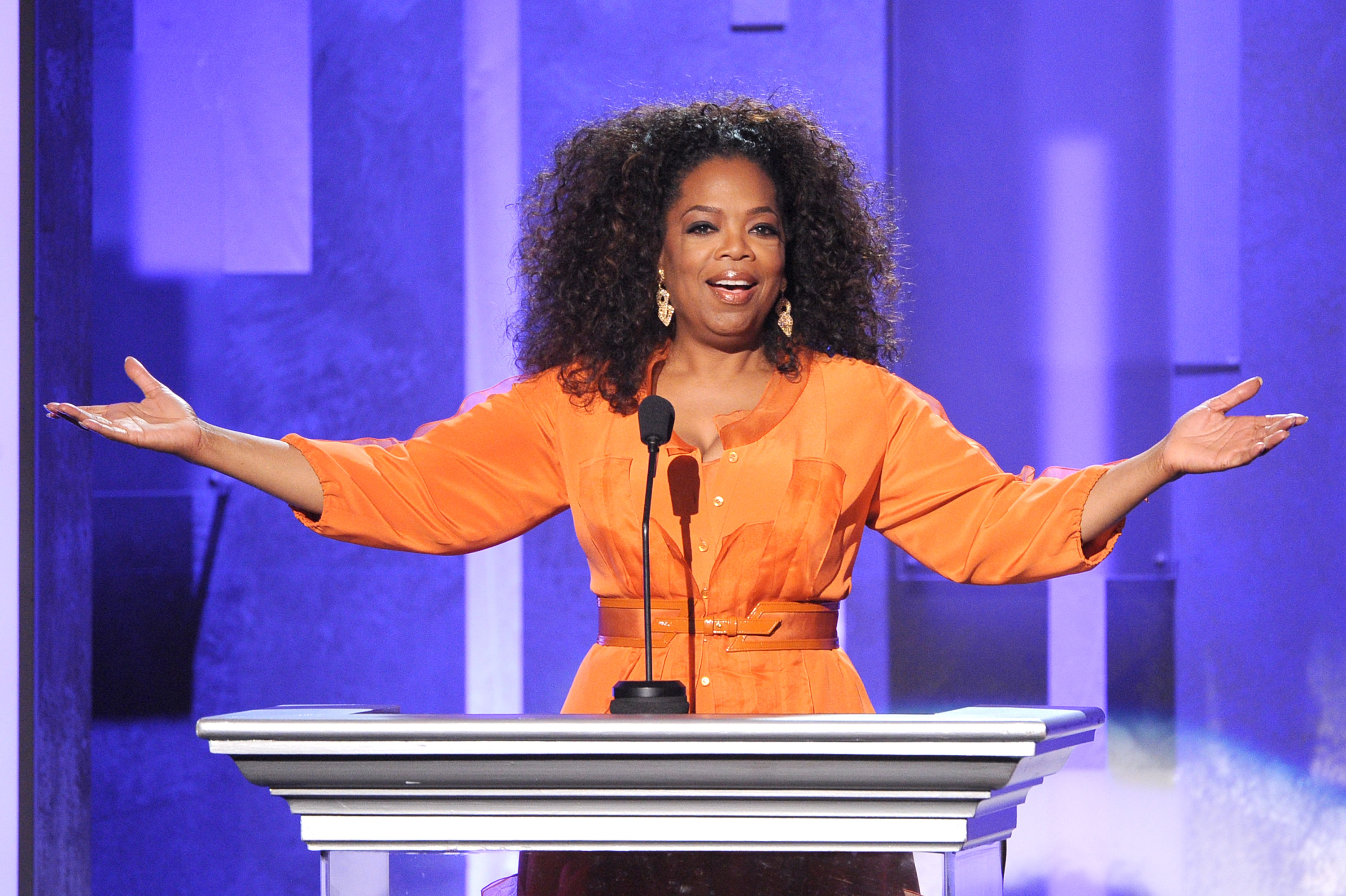Oprah raising her hands