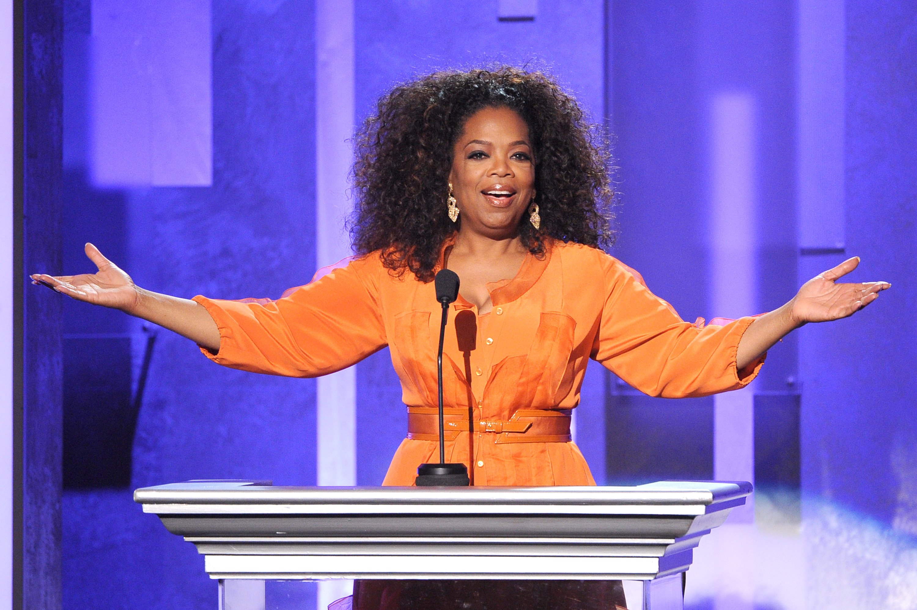 Oprah raising her hands