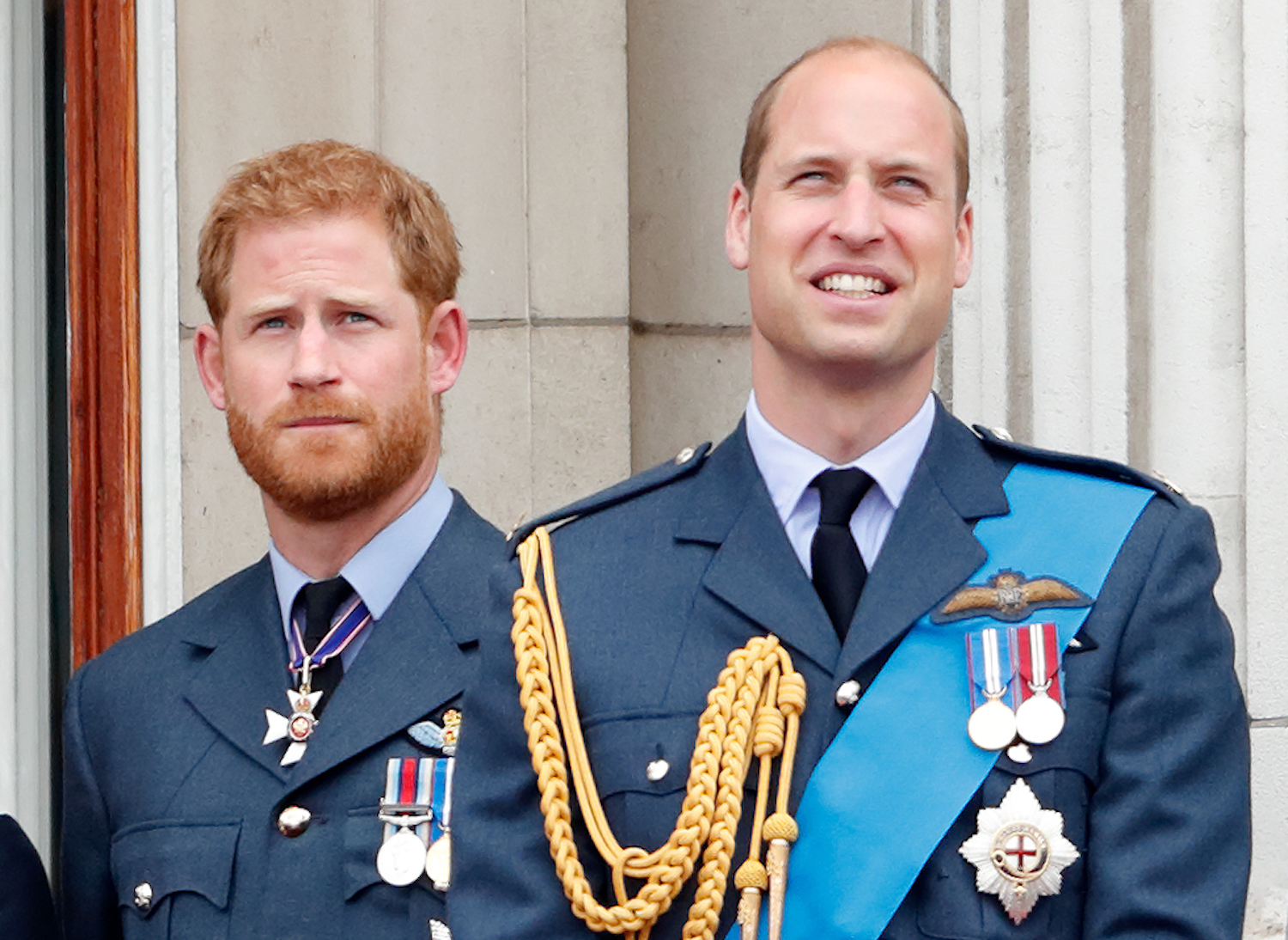 Prince Harry and Prince William watch a flypast to mark the centenary of the Royal Air Force from the balcony of Buckingham Palace