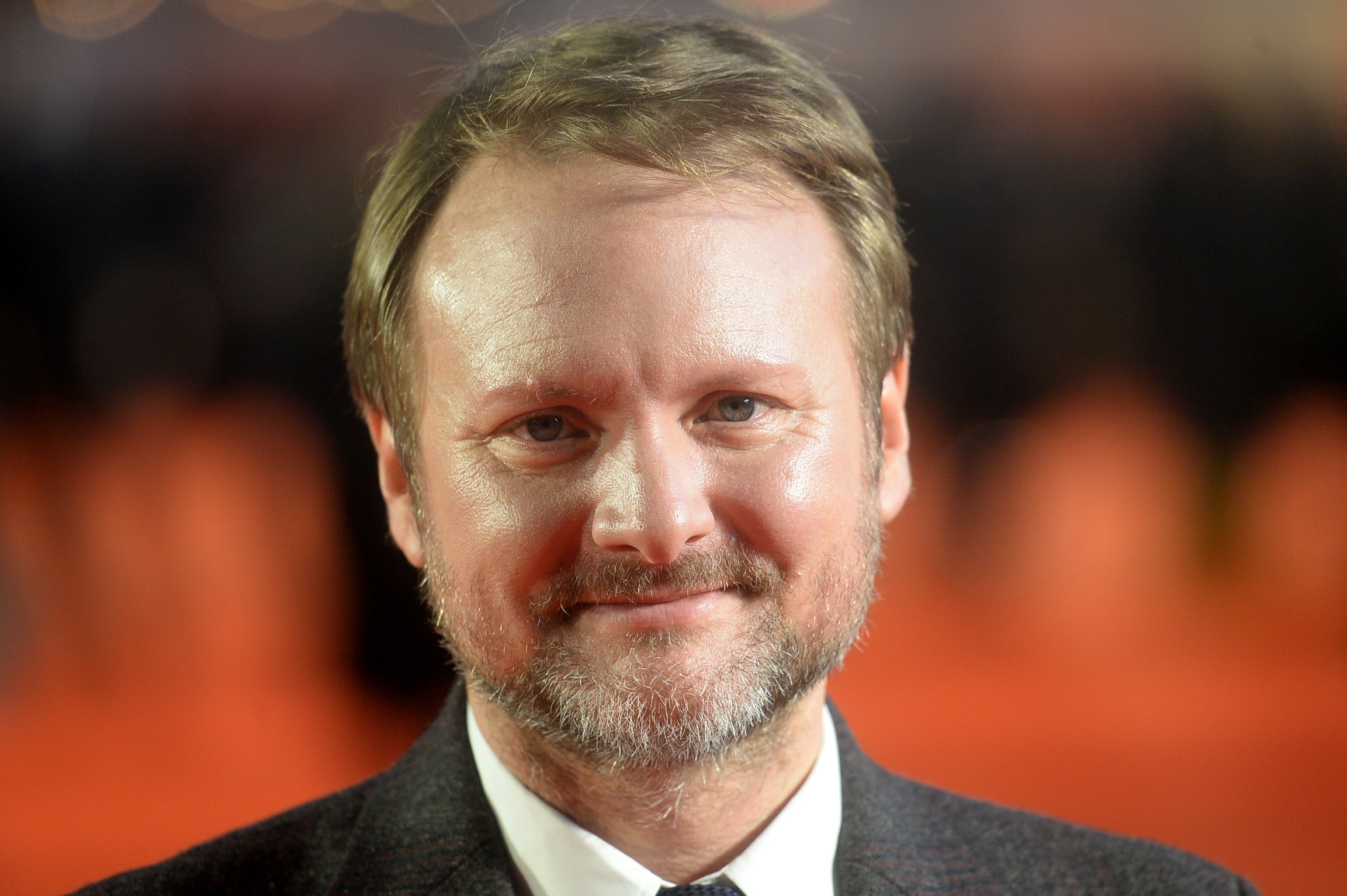 Rian Johnson wearing a suit