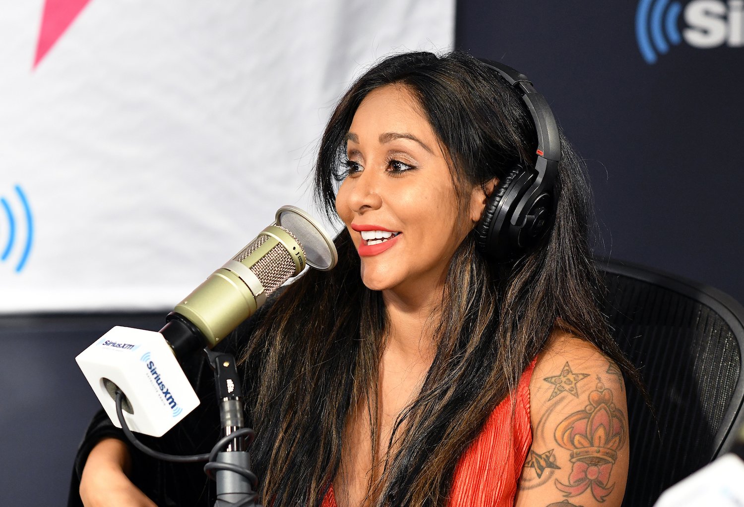 Snooki talking into microphone