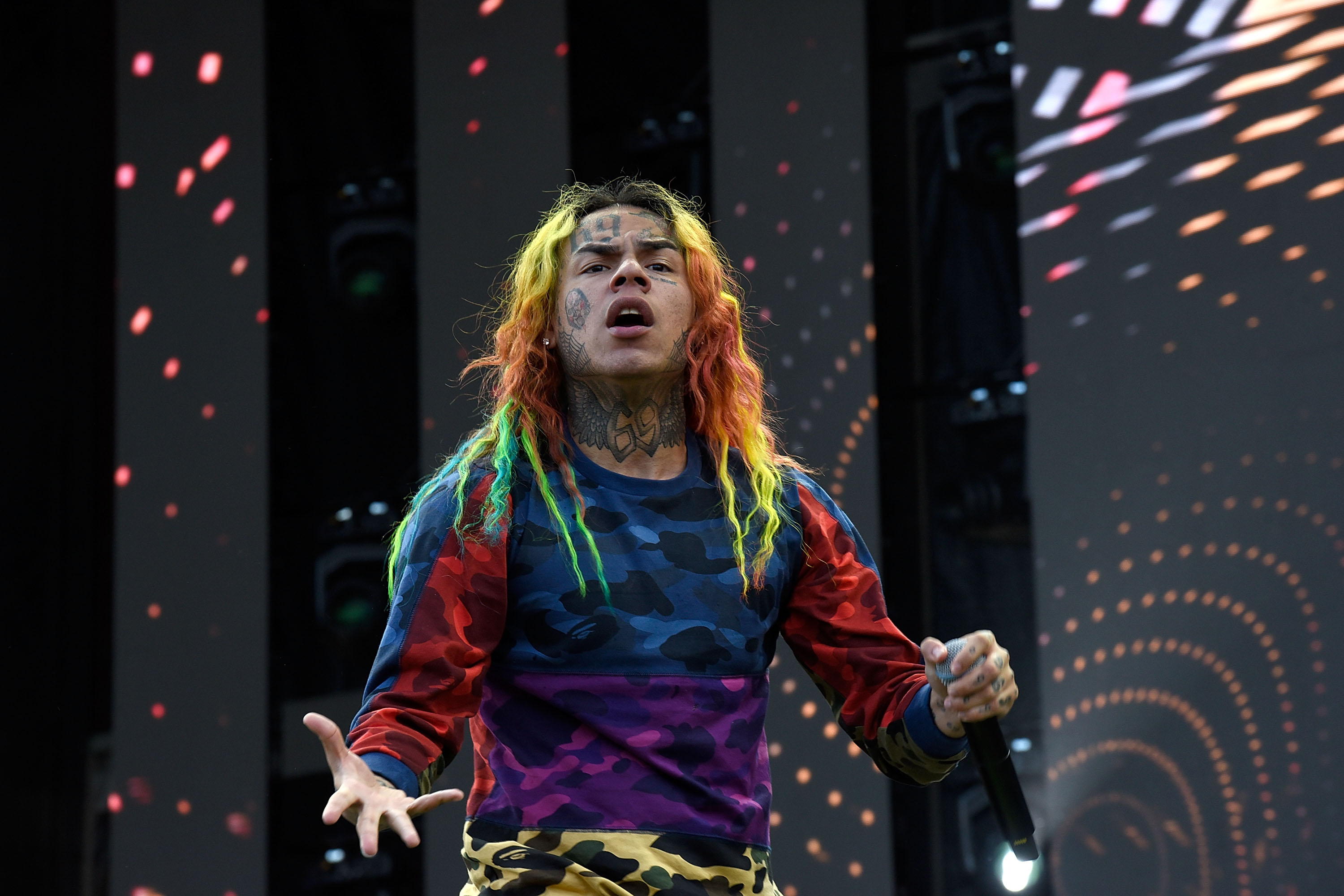 Tekashi 6ix9ine with a microphone