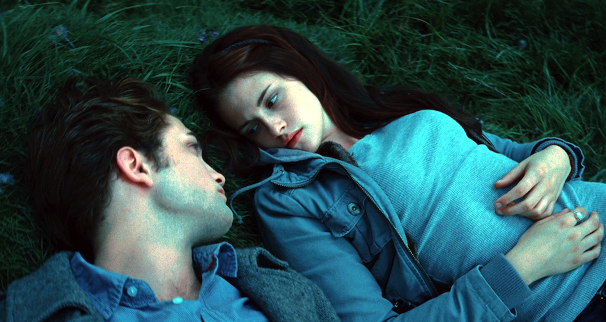 Edward Cullen (Robert Pattinson) and Bella Swan (Kristen Stewart) in his meadow in 'Twilight.'
