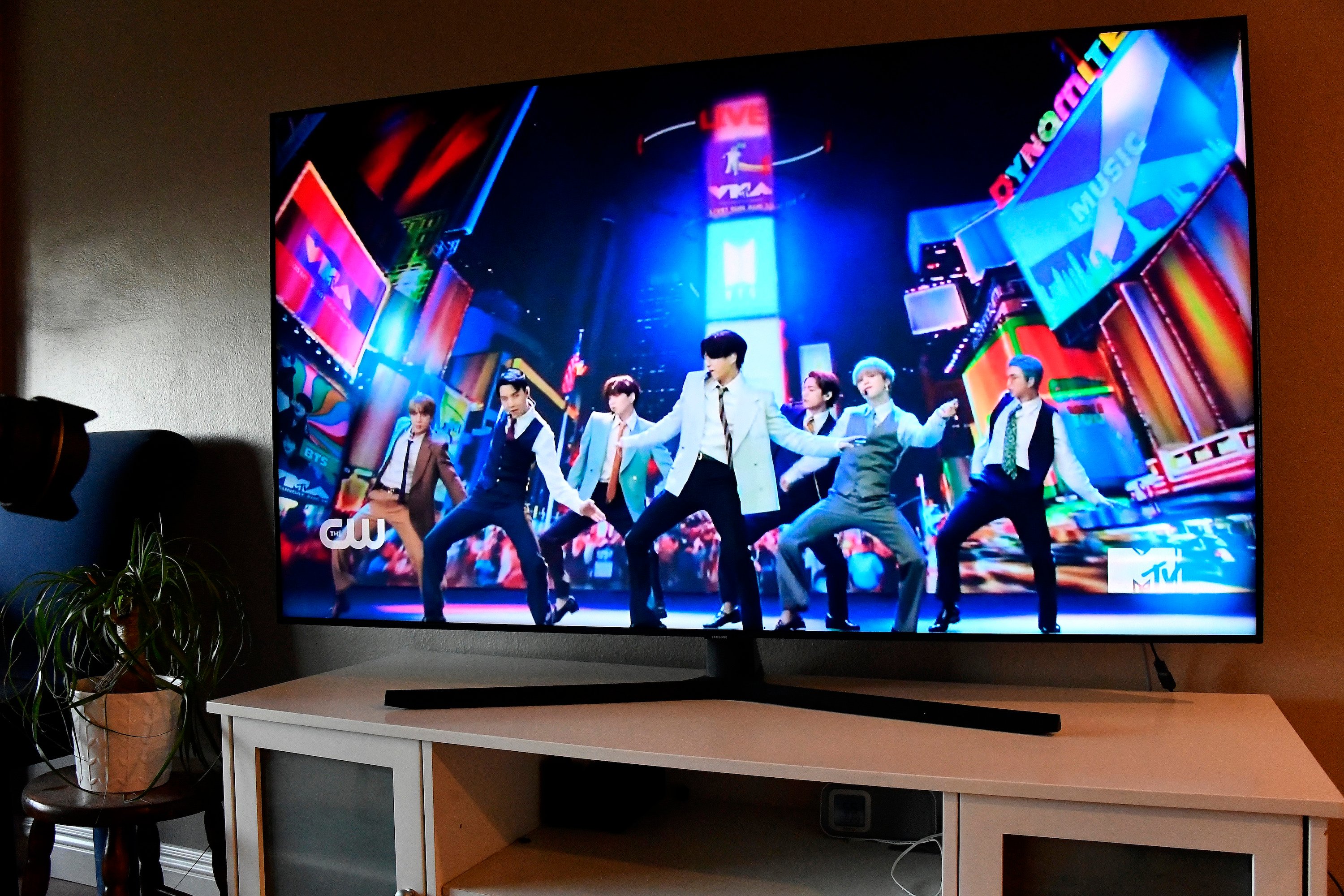 K-pop group, BTS, viewed on a television screen