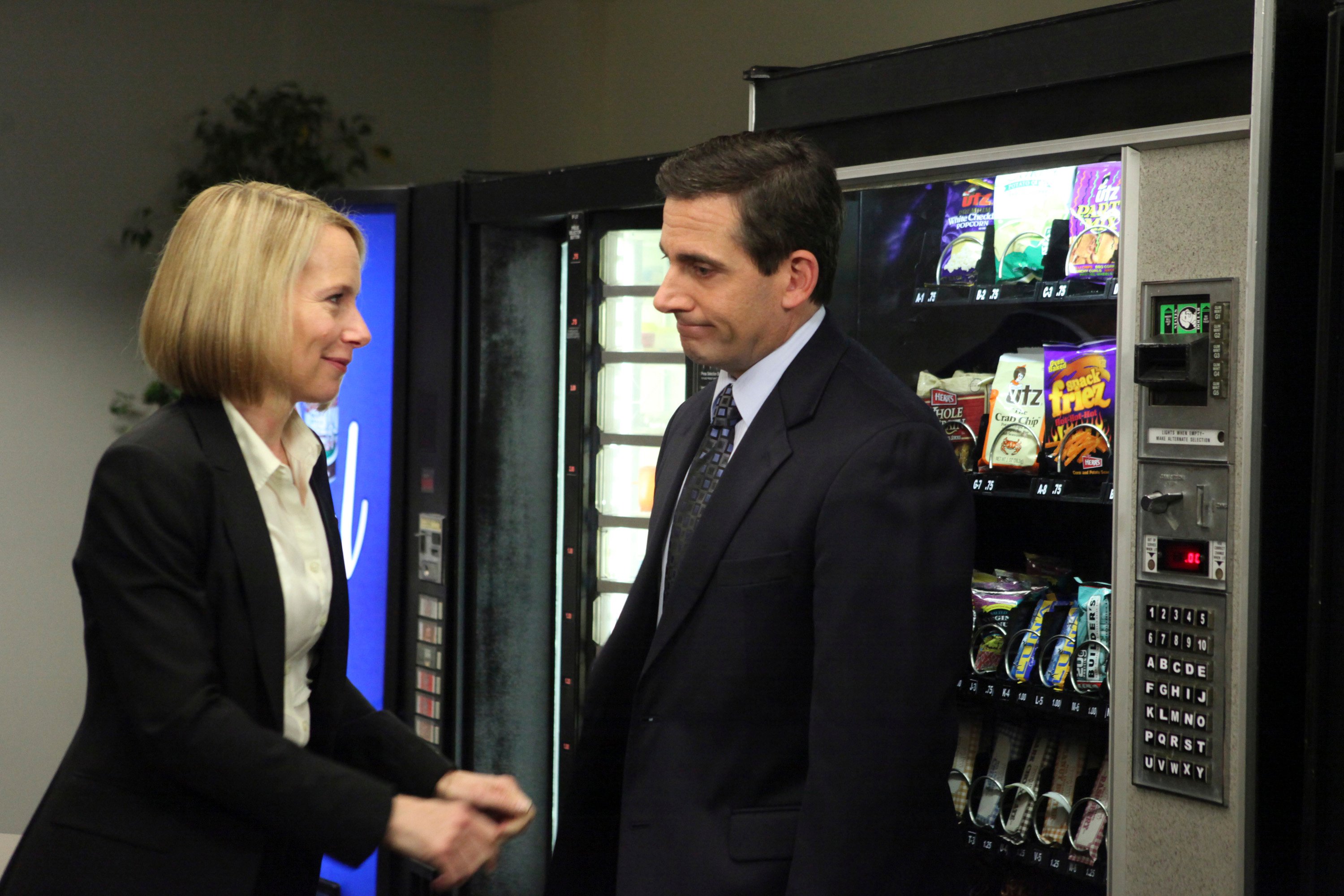 Amy Ryan as Holly Flax and Steve Carell as Michael Scott