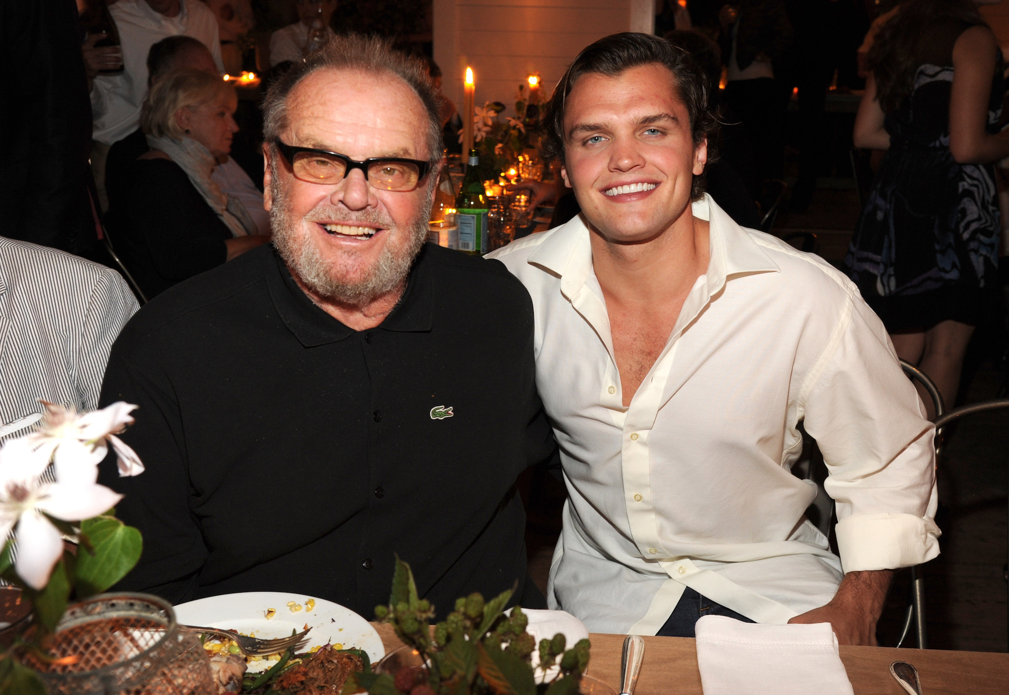 (L-R) Jack Nicholson and Ray Nicholson smiling at a dinner table