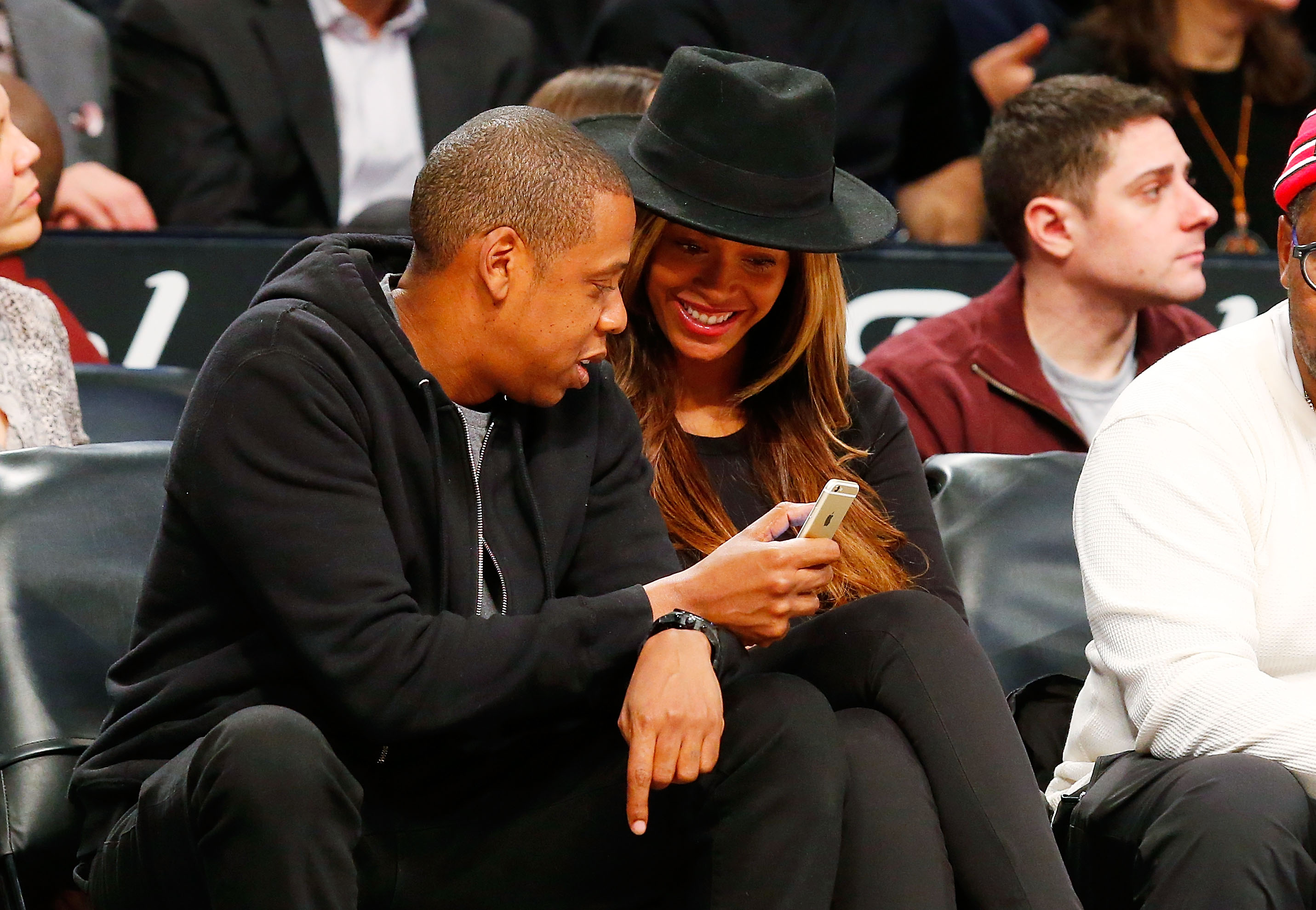 Jay-Z and Beyoncé at a basketball game