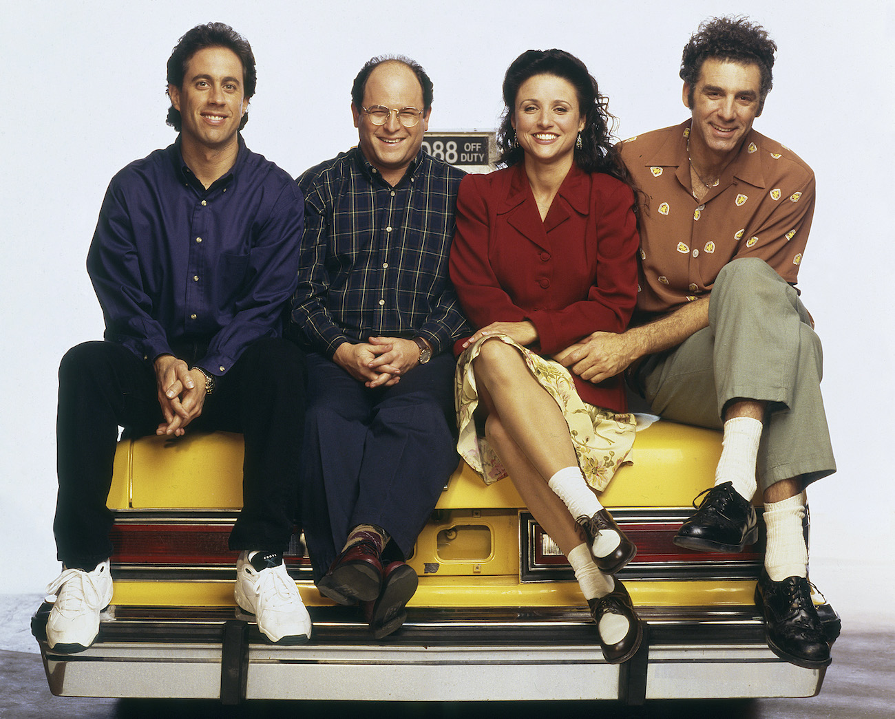 Jerry Seinfeld as Jerry Seinfeld,Jason Alexander as George Costanza, Julia Louis-Dreyfus as Elaine Benes, and Michael Richards as Cosmo Kramer on 'Seinfeld'