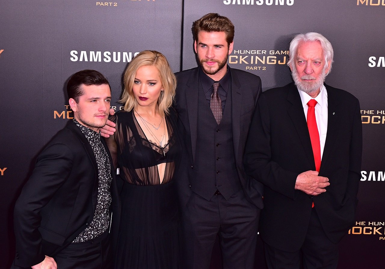 The Hunger Games books Josh Hutcherson, Jennifer Lawrence, Liam Hemsworth, and Donald Sutherland