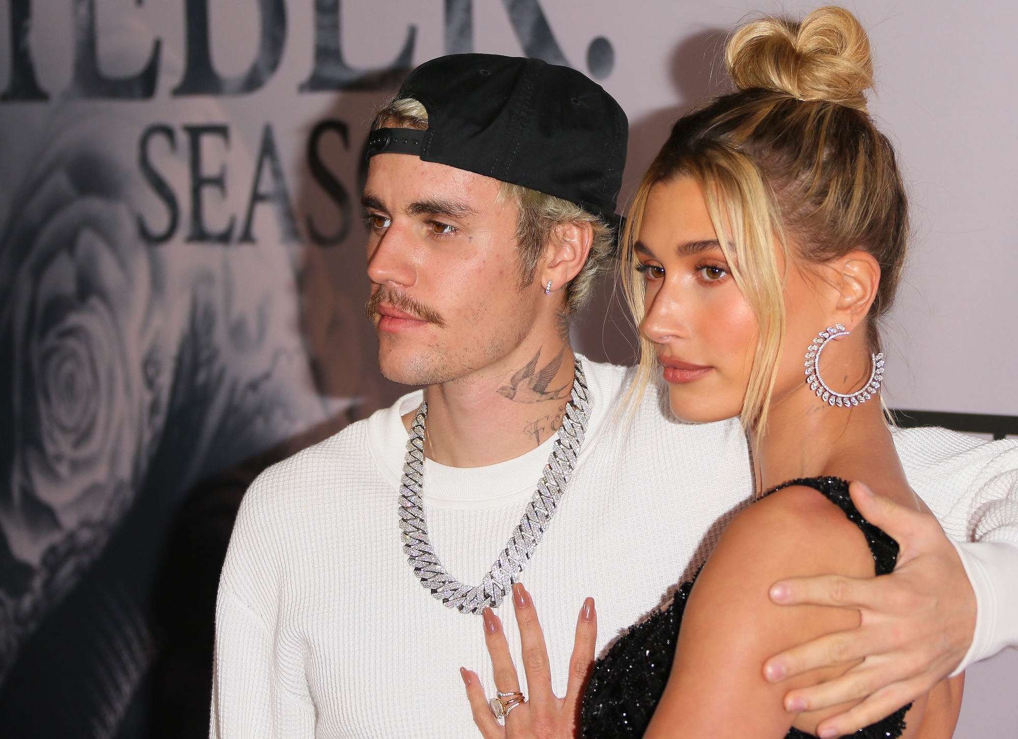 (L-R) Justin Bieber and Hailey Bieber embraced, facing the camera