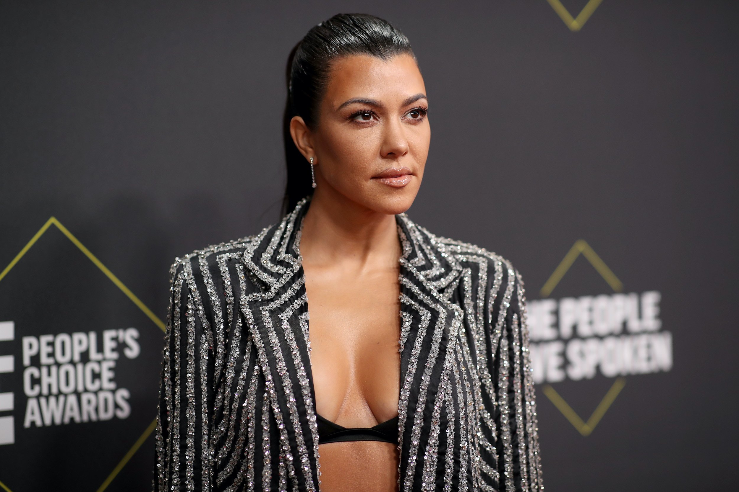 Kourtney Kardashian arrives to the 2019 E! People's Choice Awards held at the Barker Hangar on November 10, 2019.