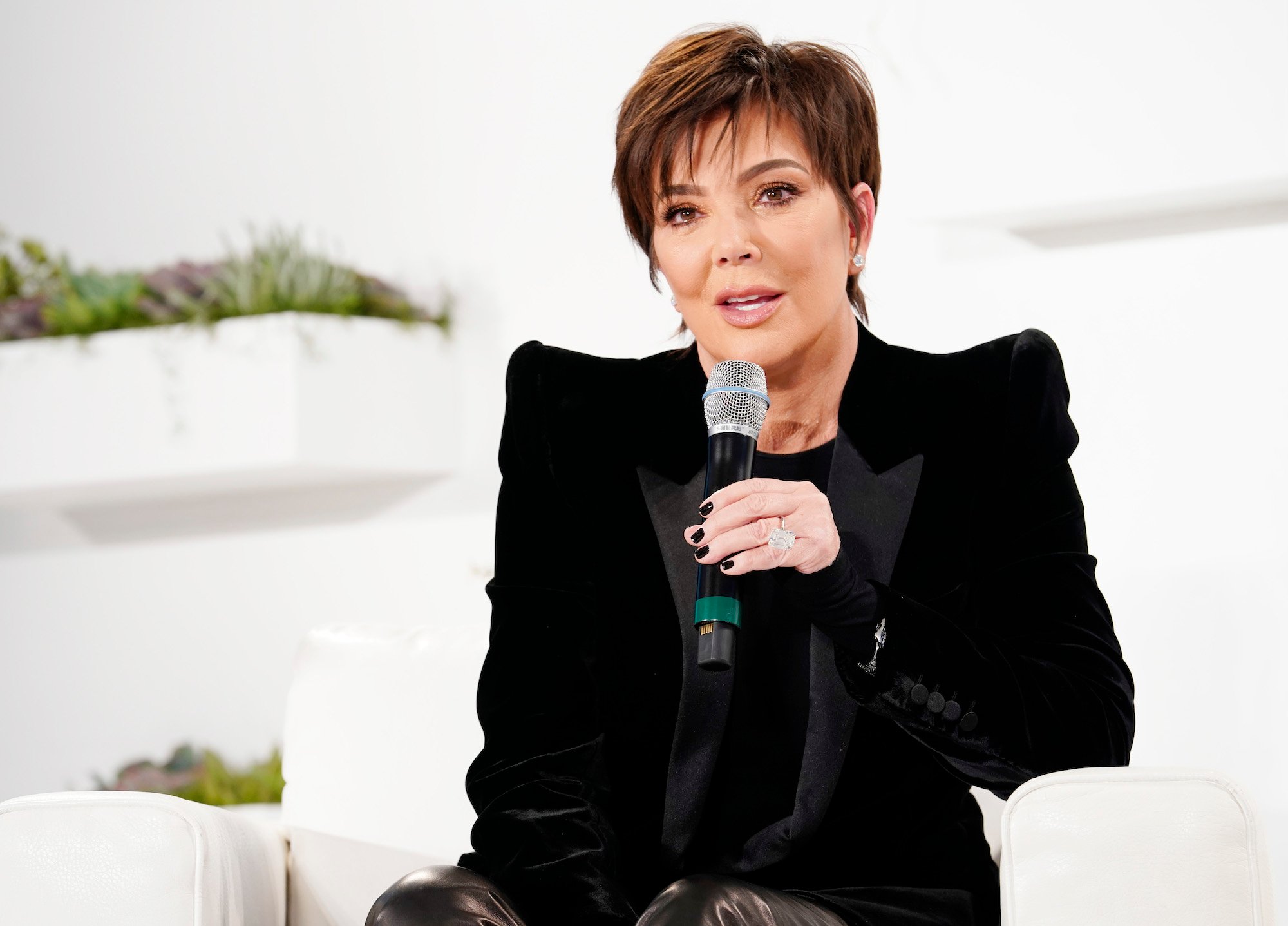 Kris Jenner talking into a microphone