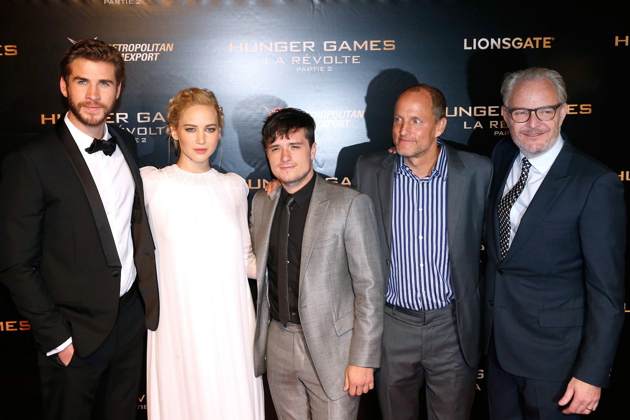 The Hunger Games cast Liam Hemsw.orth, Jennifer Lawrence, Josh Hutcherson, Woody Harrelson, and director Francis Lawrence