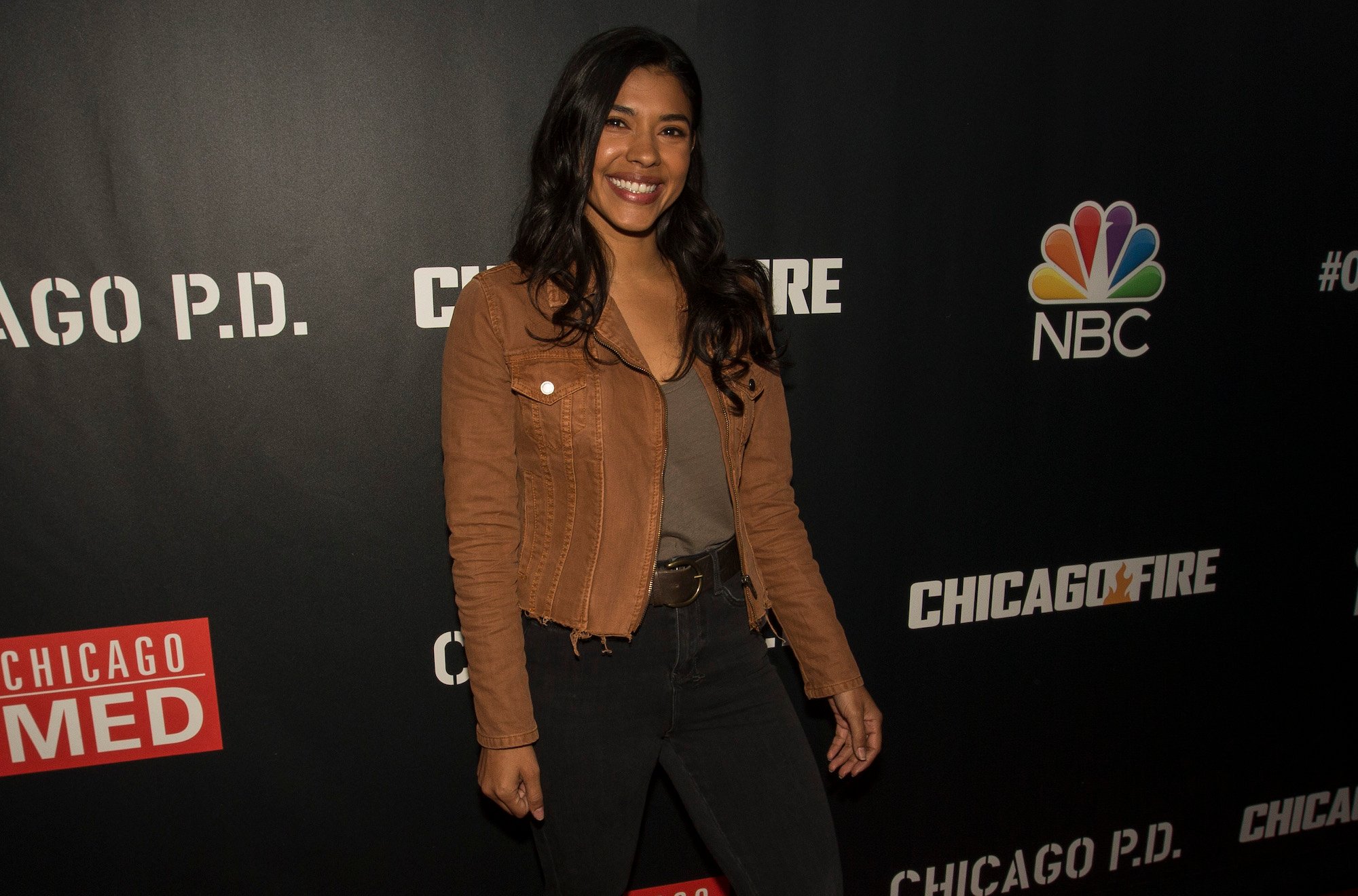 Lisseth Chavez smiling in front of a black backdrop