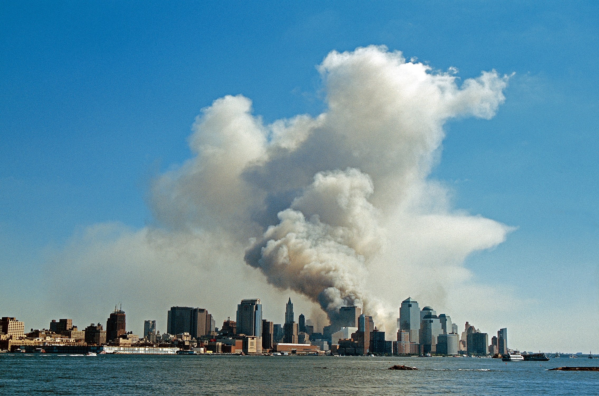 Smoke hangs over South Manhattan after the collapse of the World Trade Center in a terrorist attack, New York, New York, September 11, 2001.
