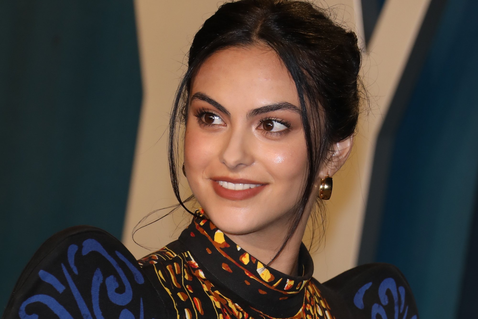 Camila Mendes smiles at the camera