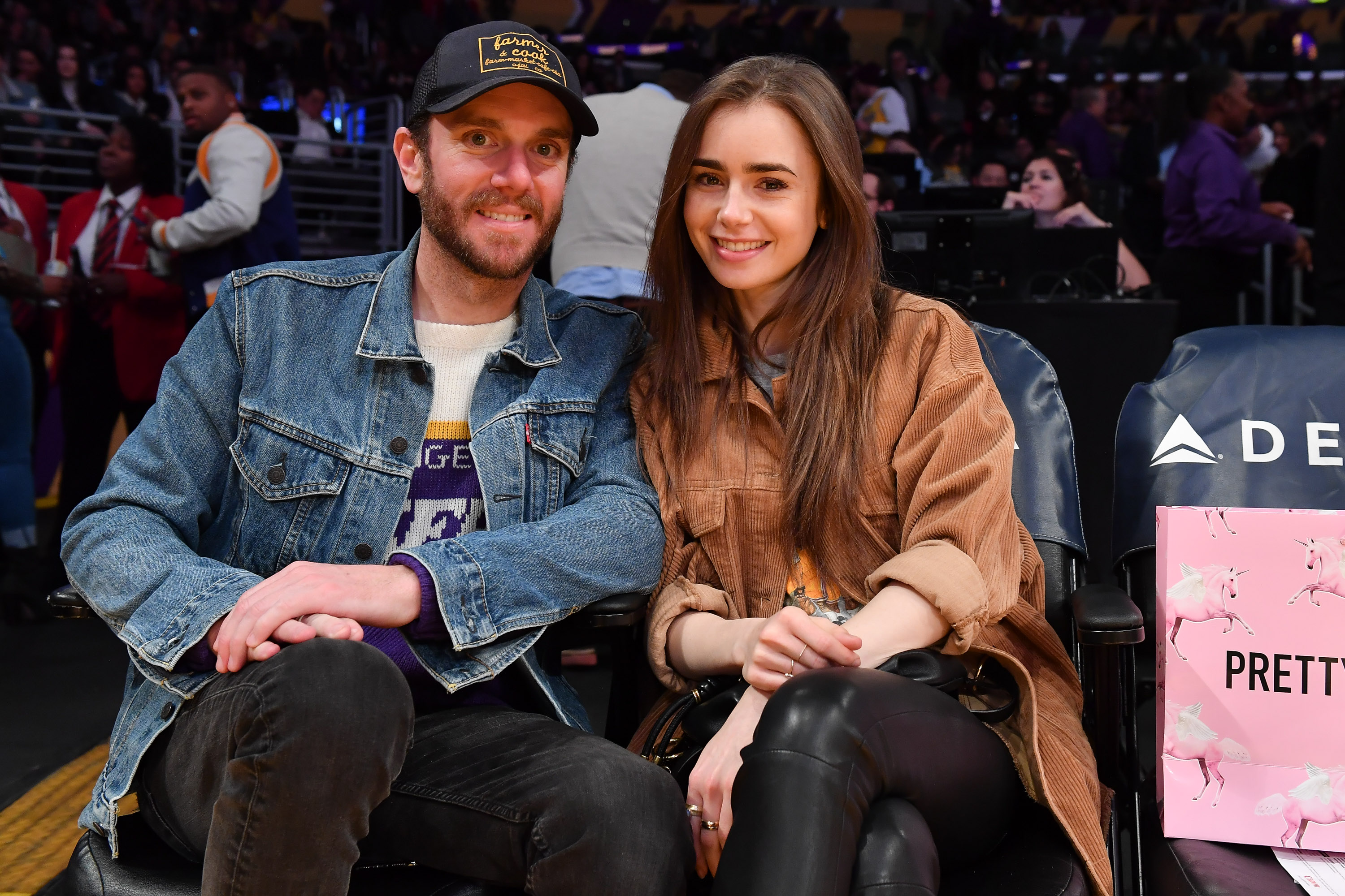 Lily Collins and Charlie McDowell attend a basketball game between the Los Angeles Lakers and the Cleveland Cavaliers on January 13, 2020